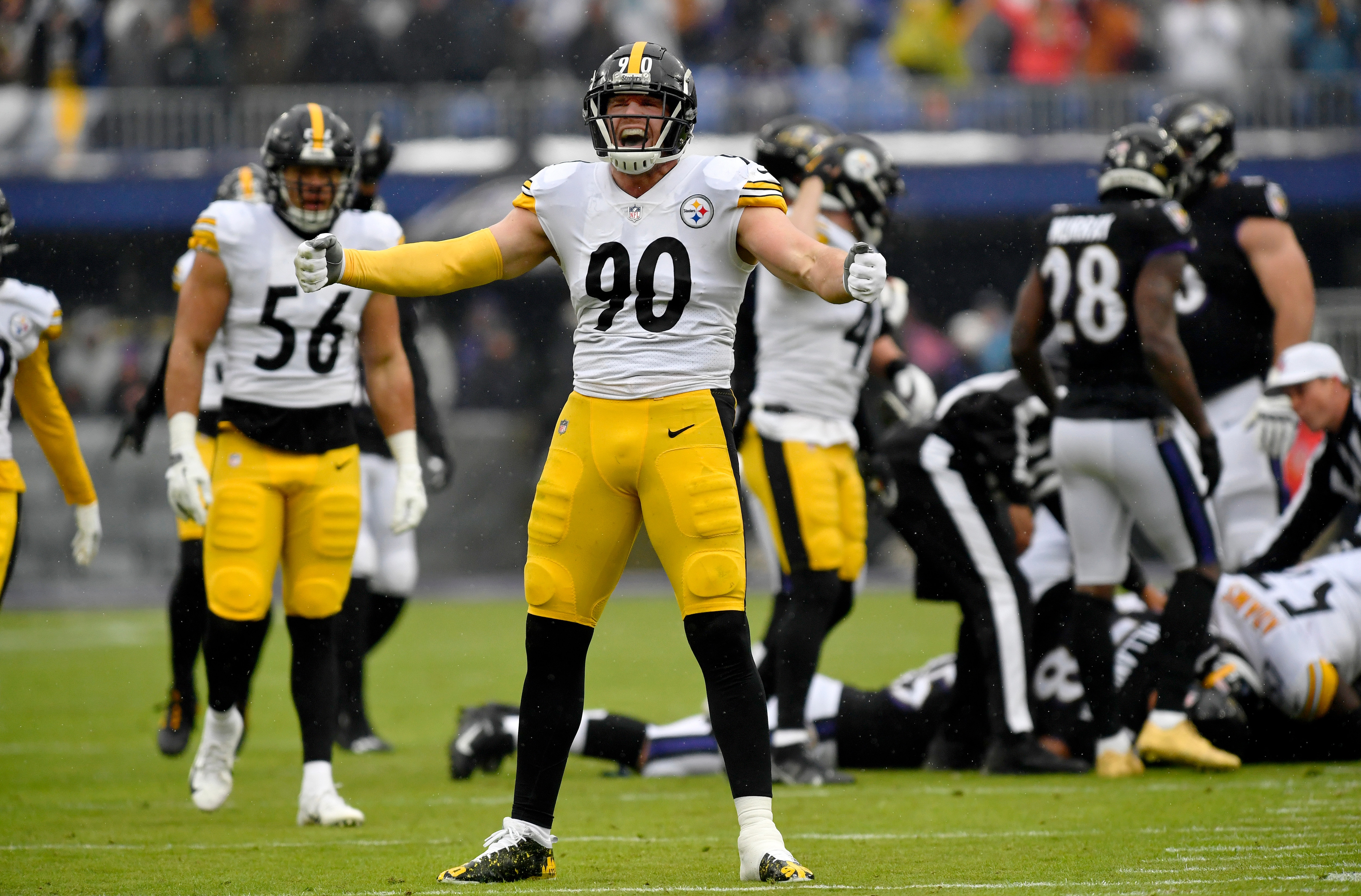 BALTIMORE, MD - JANUARY 09: Pittsburgh linebacker T.J. Watt (90) celebrates after a first quarter strip and forced fumble for a turnover during the Pittsburgh Steelers versus Baltimore Ravens National Football League game at M&T Bank Stadium on January 9, 2022 in Baltimore, MD. (Photo by Randy Litzinger/Icon Sportswire via Getty Images)