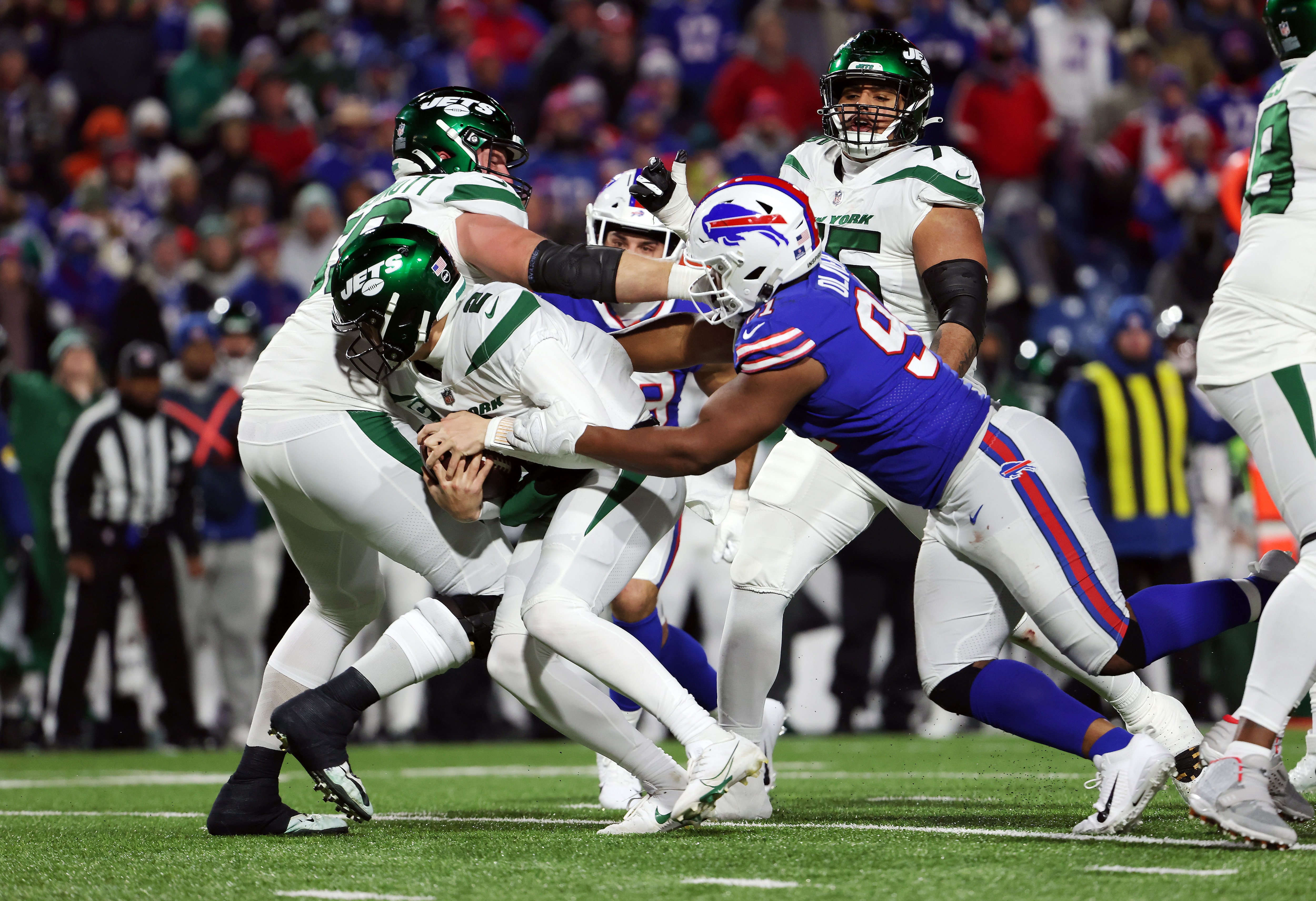 ORCHARD PARK, NEW YORK - JANUARY 09: Ed Oliver #91 of the Buffalo Bills sacks Zach Wilson #2 of the New York Jets during the third quarter at Highmark Stadium on January 09, 2022 in Orchard Park, New York. (Photo by Timothy T Ludwig/Getty Images)