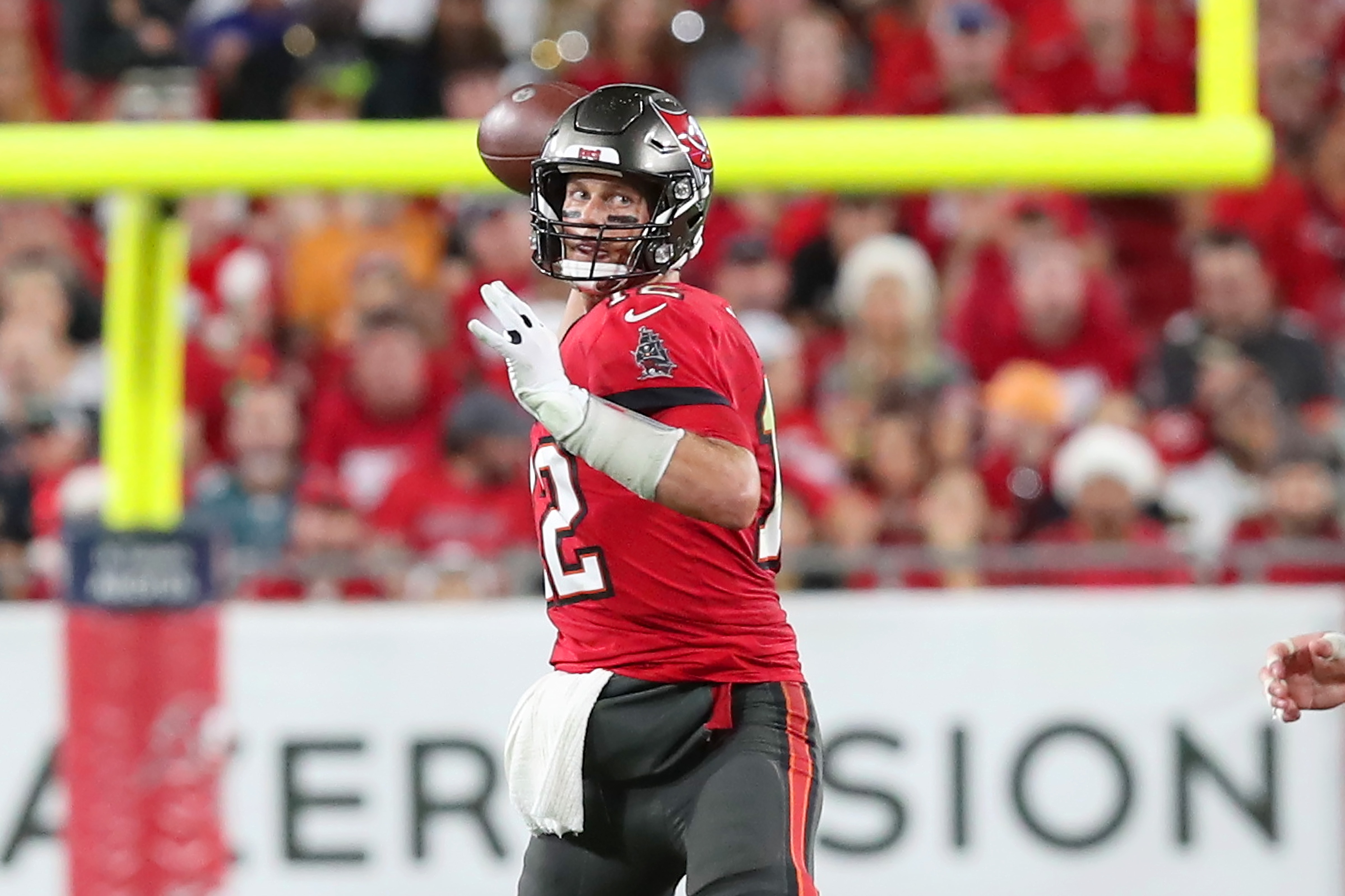 TAMPA, FL - DECEMBER 19: Tampa Bay Buccaneers Quarterback Tom Brady (12) has his eyes on a receiver during the regular season game between the New Orleans Saints and the Tampa Bay Buccaneers on December 19, 2021 at Raymond James Stadium in Tampa, Florida. (Photo by Cliff Welch/Icon Sportswire via Getty Images)