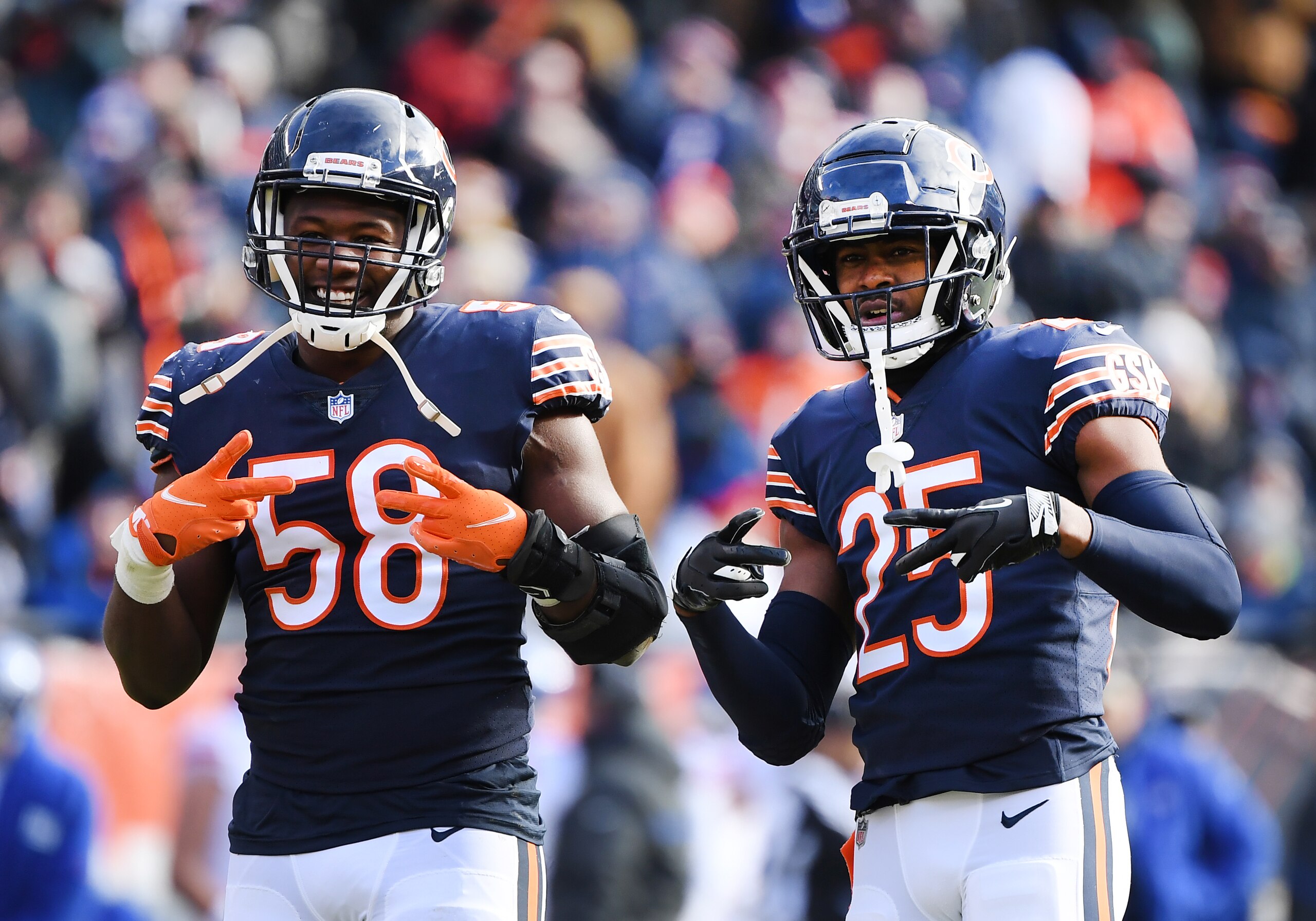 CHICAGO, ILLINOIS - JANUARY 02: Roquan Smith #58 and Artie Burns #25 of the Chicago Bears react in the second quarter of the game against the New York Giants at Soldier Field on January 02, 2022 in Chicago, Illinois. (Photo by Quinn Harris/Getty Images)