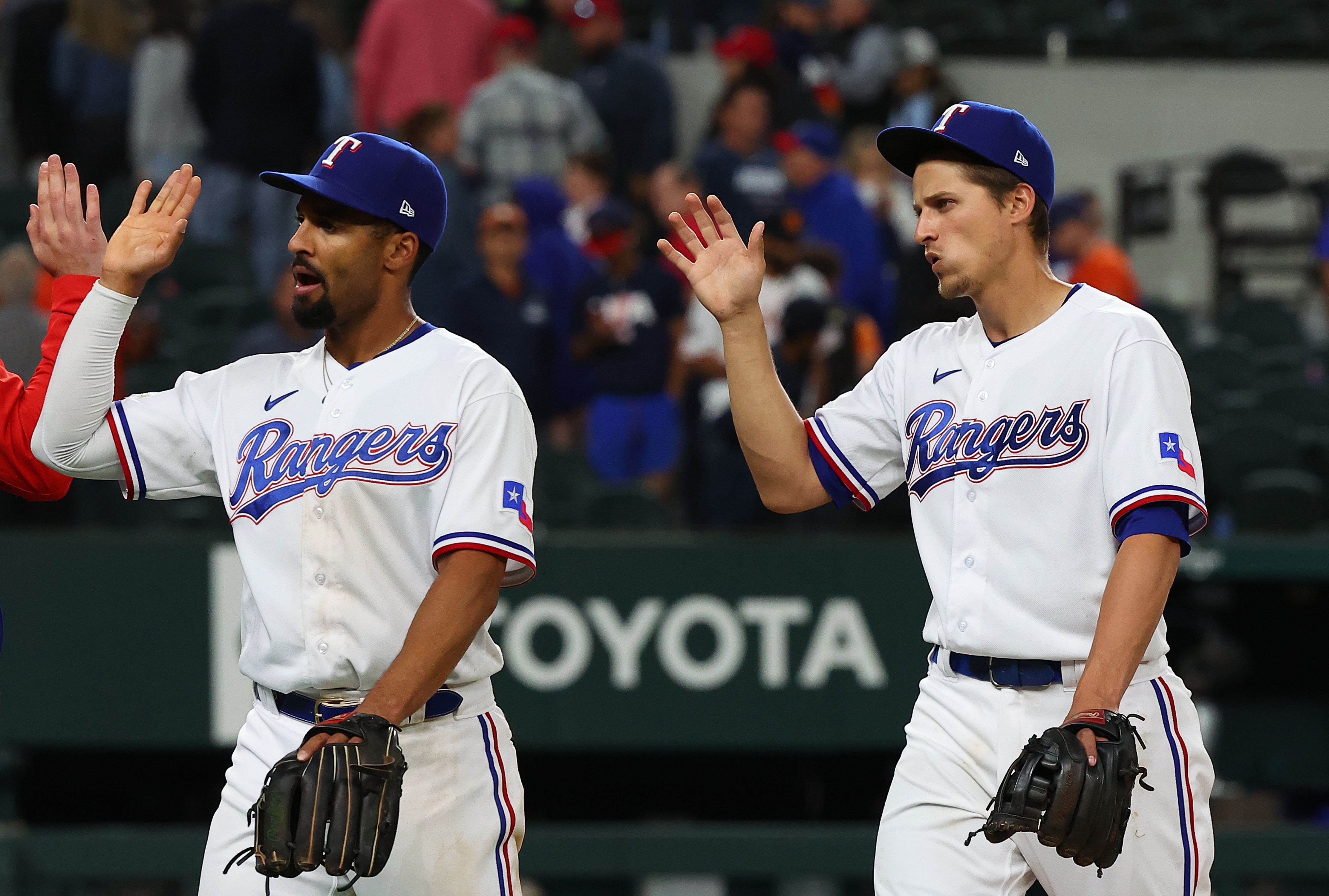 ARLINGTON, TEXAS - APRIL 25: Marcus Semien #2 and Corey Seager #5 of the Texas Rangers celebrate the win against the Houston Astros at Globe Life Field on April 25, 2022 in Arlington, Texas. (Photo by Richard Rodriguez/Getty Images)