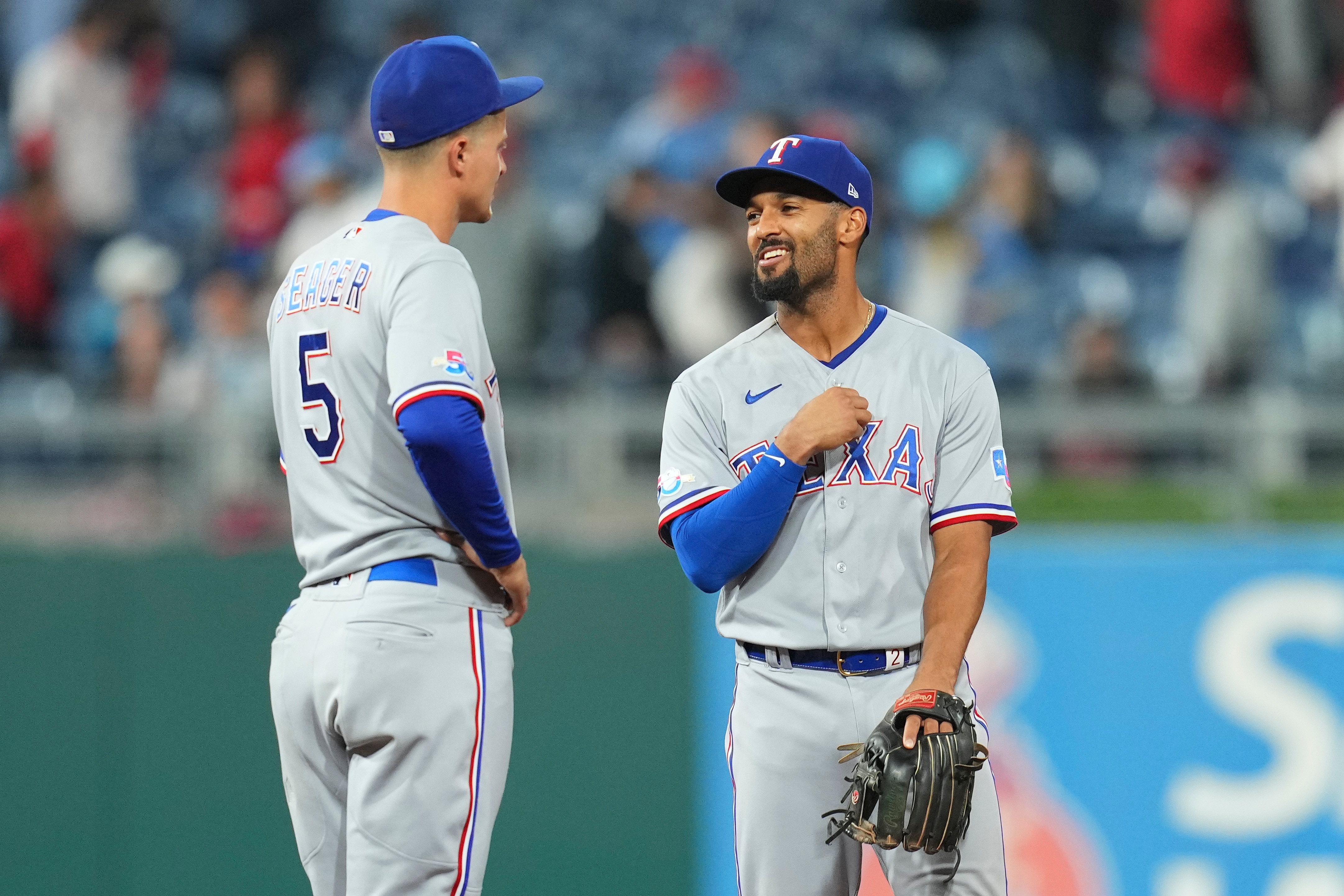 PHILADELPHIA, PA - MAY 04: Corey Seager #5 and Marcus Semien #2 of the Texas Rangers react after the game against the Philadelphia Phillies at Citizens Bank Park on May 4, 2022 in Philadelphia, Pennsylvania. (Photo by Mitchell Leff/Getty Images)