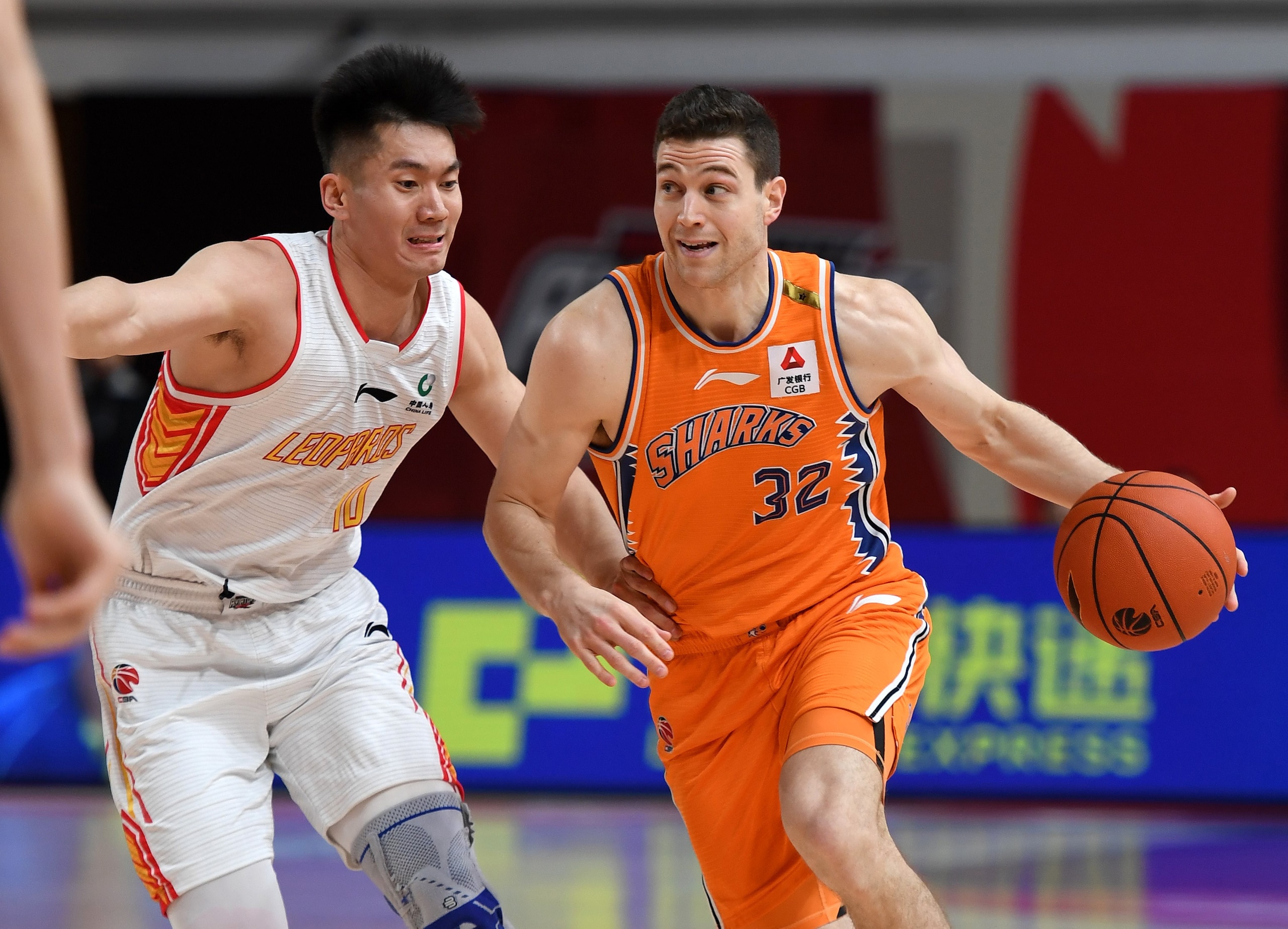 ZHUJI, April 5, 2021 -- Jimmer Fredette R of Shanghai Sharks breaks through during the 53rd round match between Shanghai Sharks and Shenzhen Aviators at the 2020-2021 season of the Chinese Basketball Association CBA league in Zhuji, east China's Zhejiang Province, April 5, 2021. (Photo by Li Ziheng/Xinhua via Getty) (Xinhua/Li Ziheng via Getty Images)