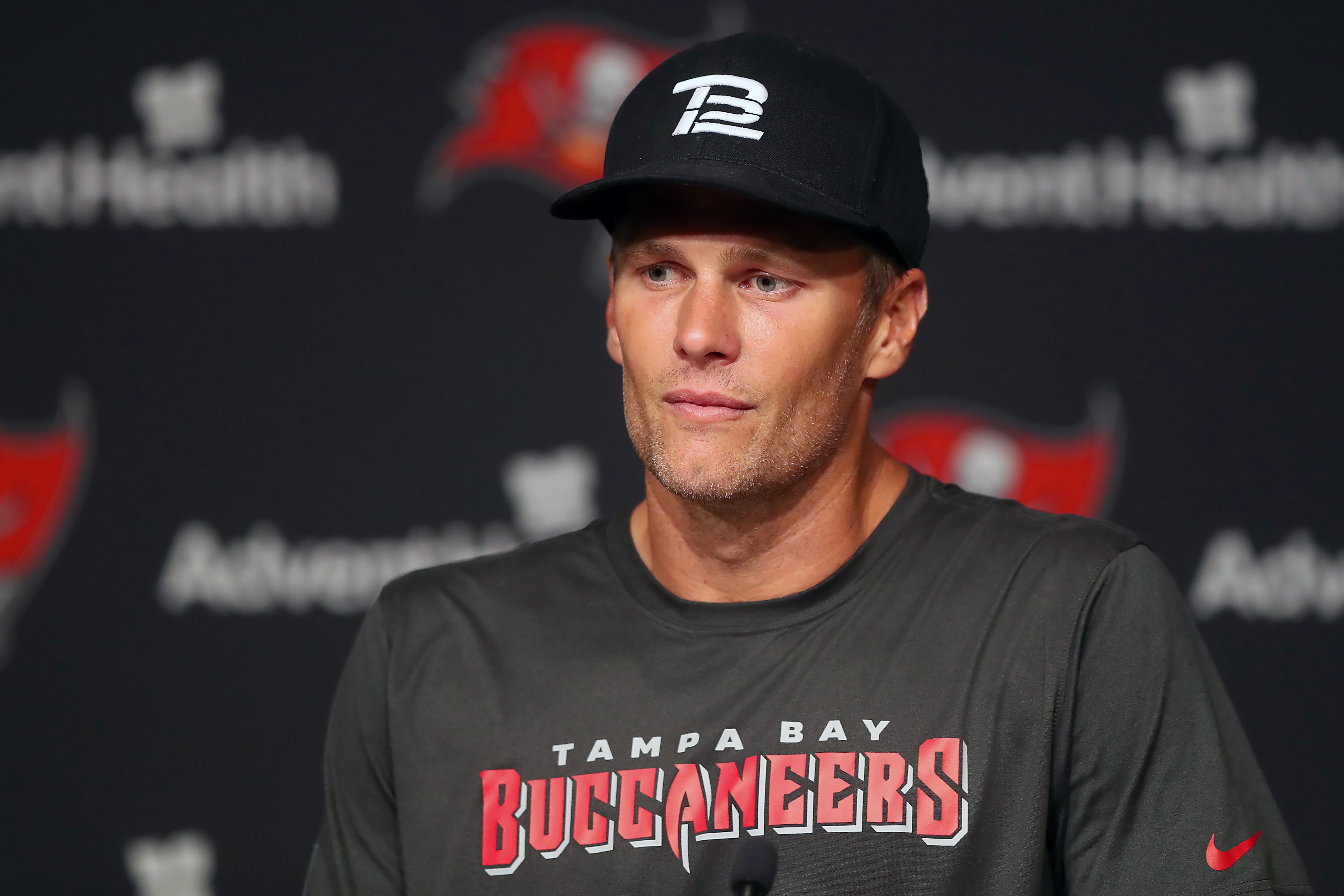 TAMPA, FL - JUN 09: Tampa Bay Buccaneers quarterback Tom Brady (12) speaks to the media after the Tampa Bay Buccaneers Minicamp on June 09, 2022 at the AdventHealth Training Center at One Buccaneer Place in Tampa, Florida. (Photo by Cliff Welch/Icon Sportswire via Getty Images)