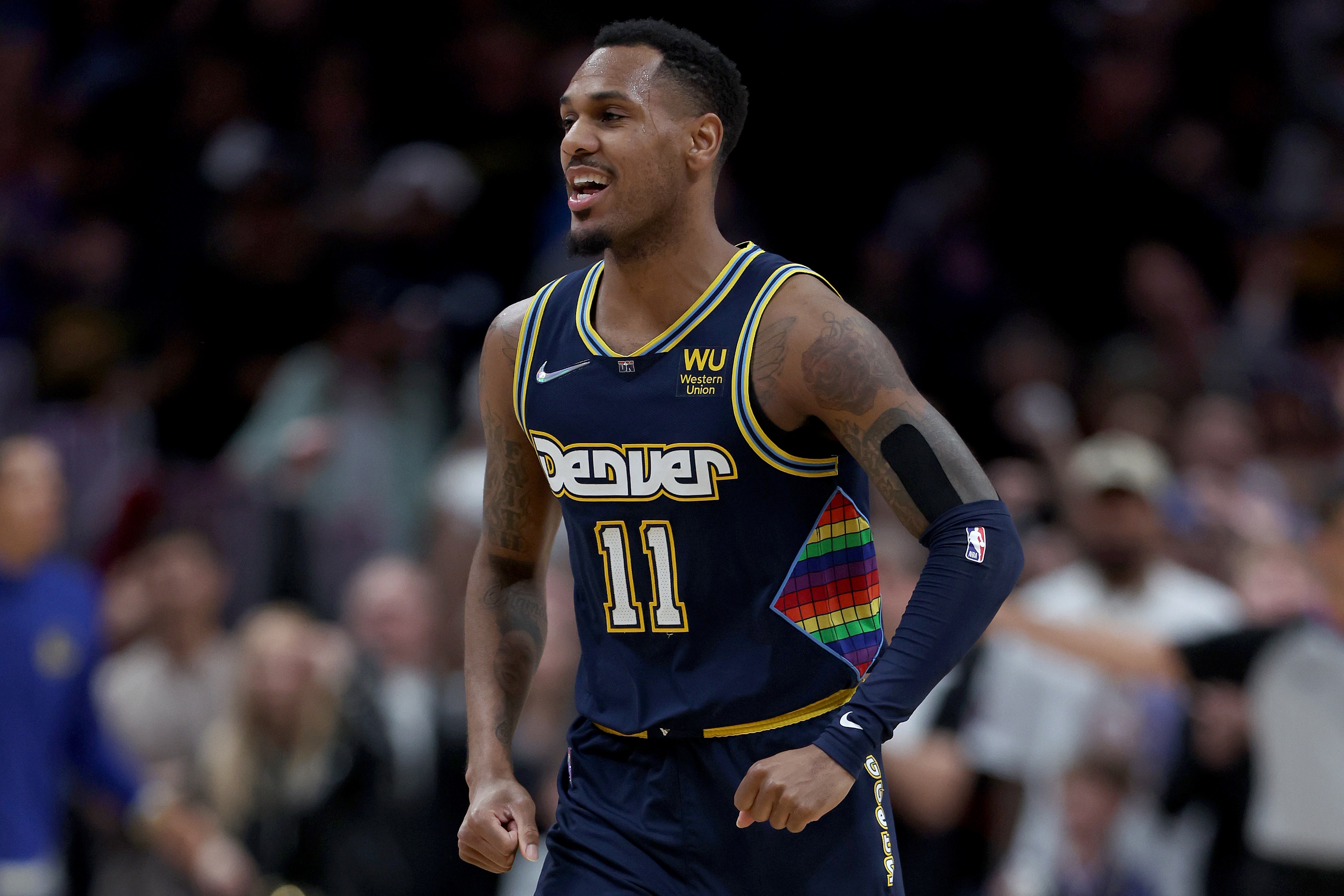 DENVER, COLORADO - APRIL 24: Monte Morris #11 of the Denver Nuggets celebrates against the Golden State Warriors in the fourth quarter during Game Four of the Western Conference First Round NBA Playoffs at Ball Arena on April 24, 2022 in Denver, Colorado. NOTE TO USER: User expressly acknowledges and agrees that, by downloading and/or using this photograph, User is consenting to the terms and conditions of the Getty Images License Agreement. (Photo by Matthew Stockman/Getty Images)