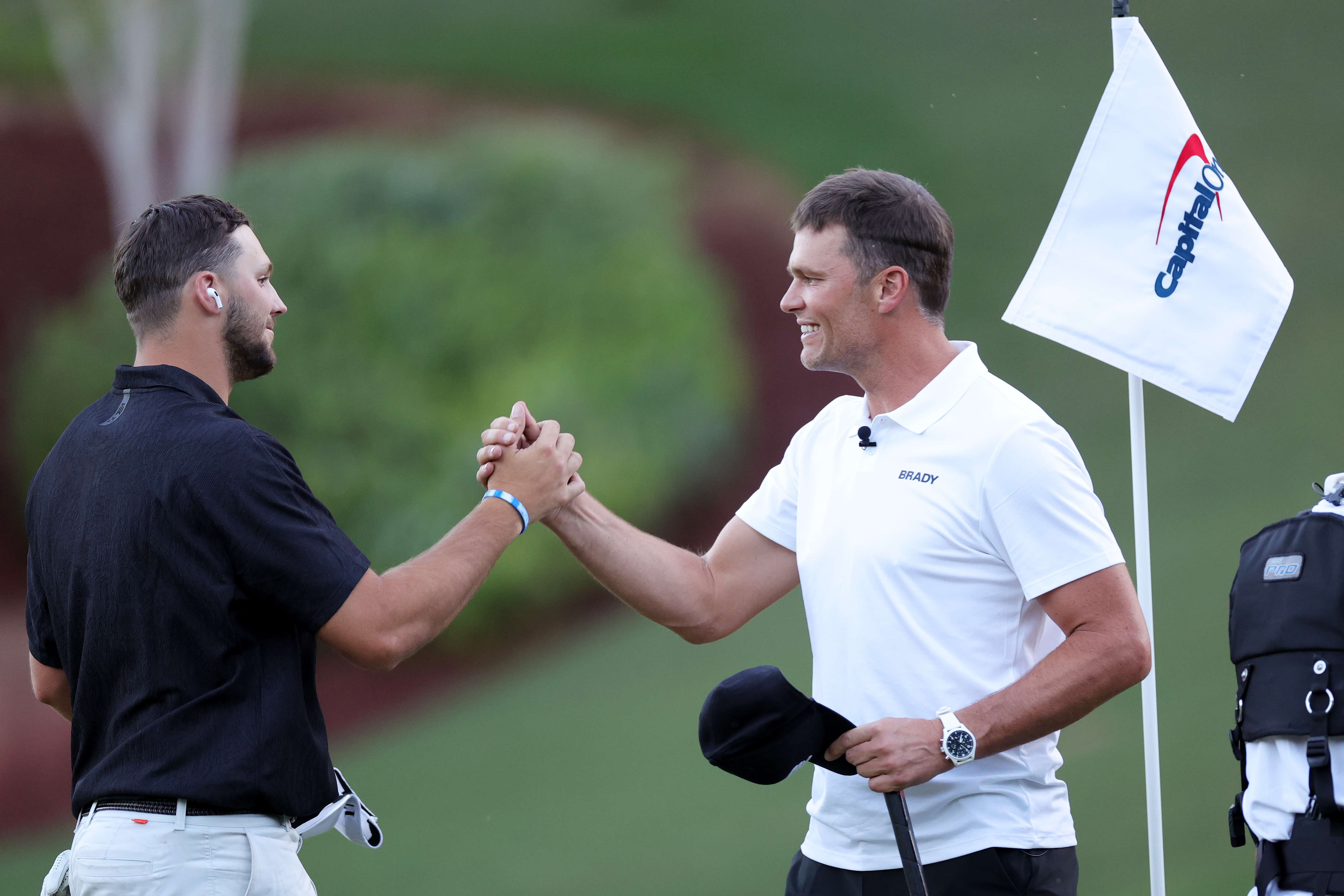 LAS VEGAS, NEVADA - JUNE 01: Josh Allen and Tom Brady embrace during Capital One's The Match VI - Brady & Rodgers v Allen & Mahomes at Wynn Golf Club on June 01, 2022 in Las Vegas, Nevada. (Photo by Carmen Mandato/Getty Images for The Match)