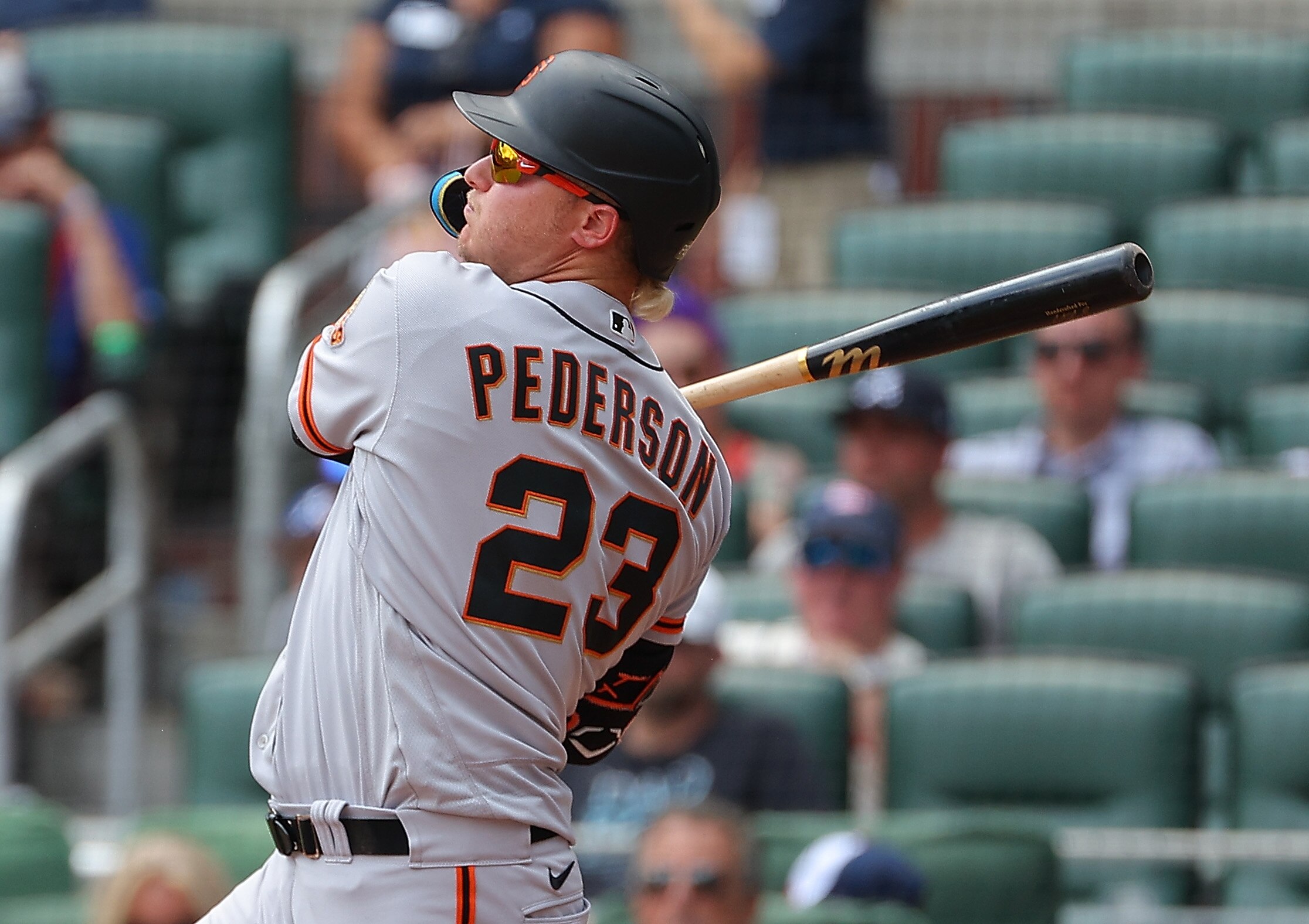 ATLANTA, GEORGIA - JUNE 23:  Joc Pederson #23 of the San Francisco Giants hits a solo homer in the ninth inning against the Atlanta Braves at Truist Park on June 23, 2022 in Atlanta, Georgia. (Photo by Kevin C. Cox/Getty Images)