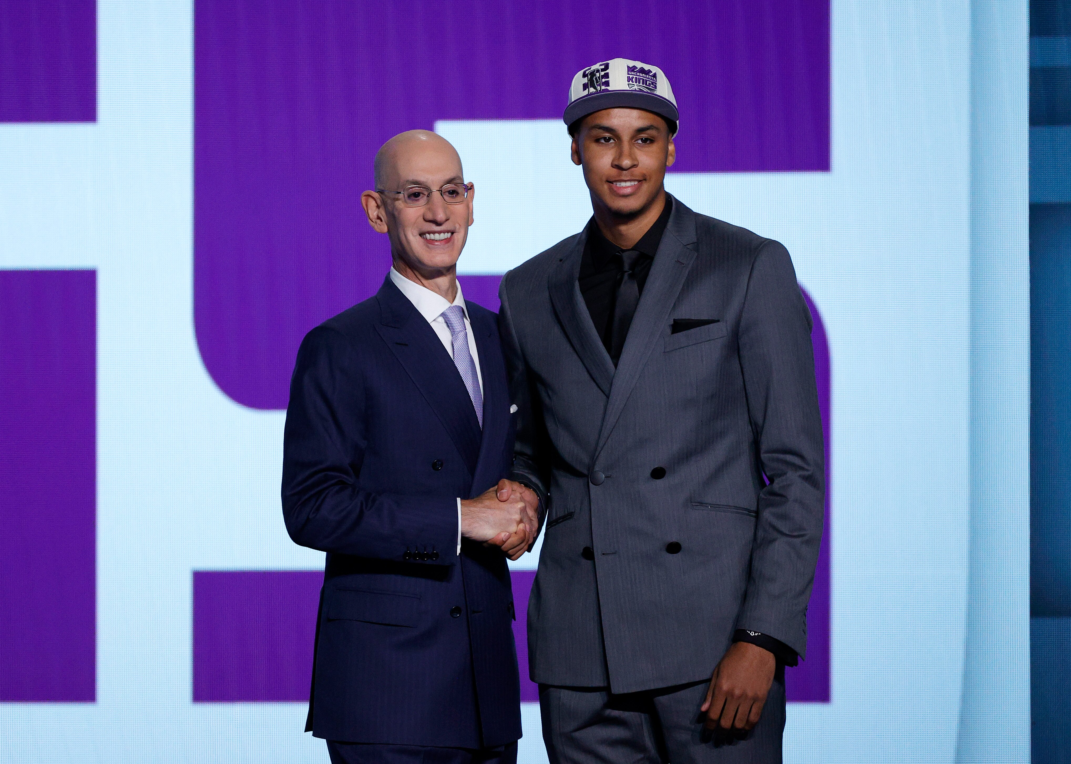 NEW YORK, NEW YORK - JUNE 23: NBA commissioner Adam Silver (L) and Keegan Murray pose for photos after Murray was drafted with the 4th overall pick by the Sacramento Kings during the 2022 NBA Draft at Barclays Center on June 23, 2022 in New York City. NOTE TO USER: User expressly acknowledges and agrees that, by downloading and or using this photograph, User is consenting to the terms and conditions of the Getty Images License Agreement. (Photo by Sarah Stier/Getty Images)