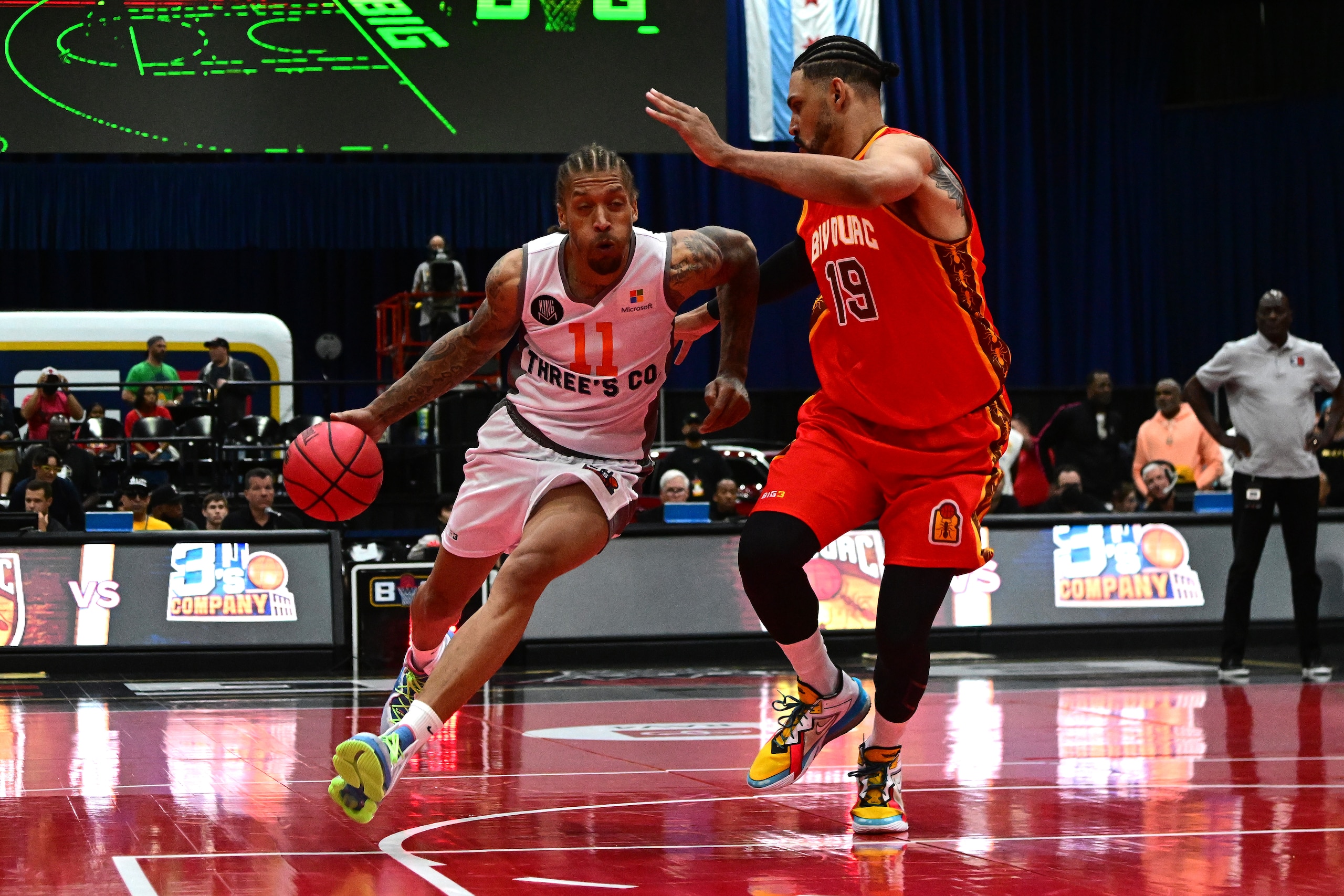 CHICAGO, ILLINOIS - JUNE 18: Michael Beasley #11 of 3's Company dribbles against Jeff Ayres #19 of Bivouac during Week One at Credit Union 1 Arena on June 18, 2022 in Chicago, Illinois. (Photo by Quinn Harris/Getty Images for BIG3)