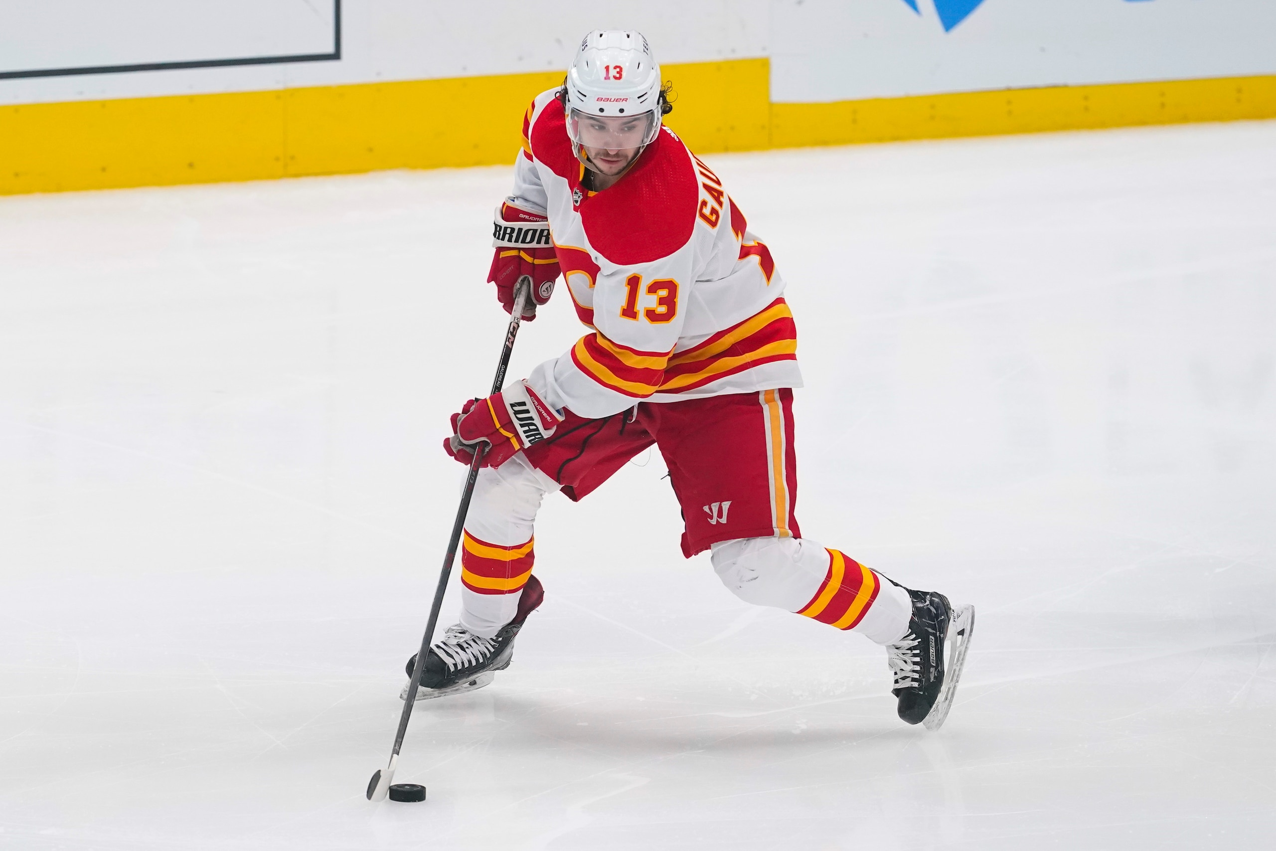Calgary Flames left wing Johnny Gaudreau skates with the puck against the Dallas Stars during the third period of Game 6 of an NHL hockey Stanley Cup first-round playoff series, Friday, May 13, 2022, in Dallas. (AP Photo/Tony Gutierrez)