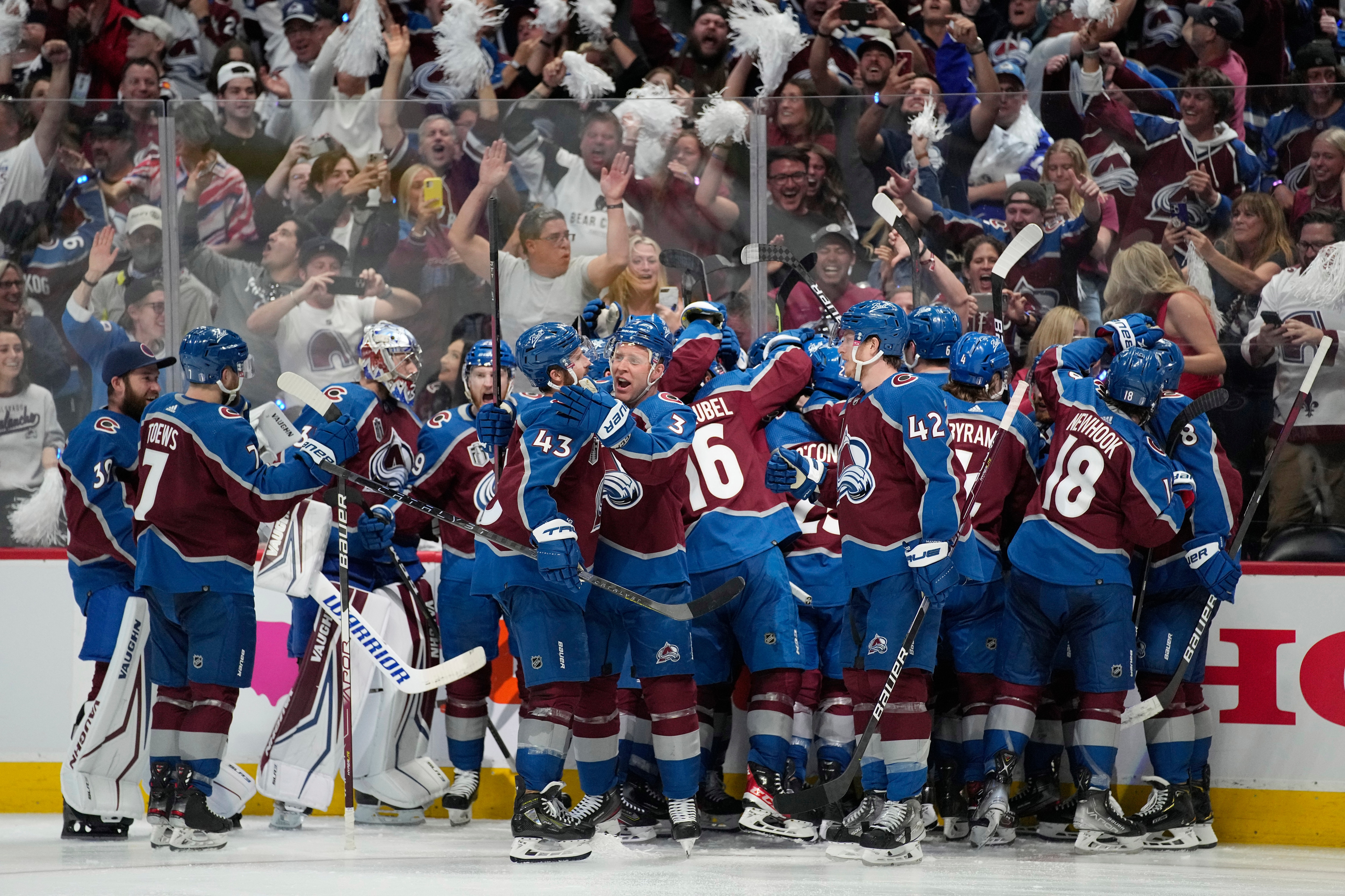 The Colorado Avalanche celebrate after an overtime win over Tampa Bay Lightning in Game 1 of the NHL hockey Stanley Cup Final on Wednesday, June 15, 2022, in Denver. (AP Photo/John Locher)