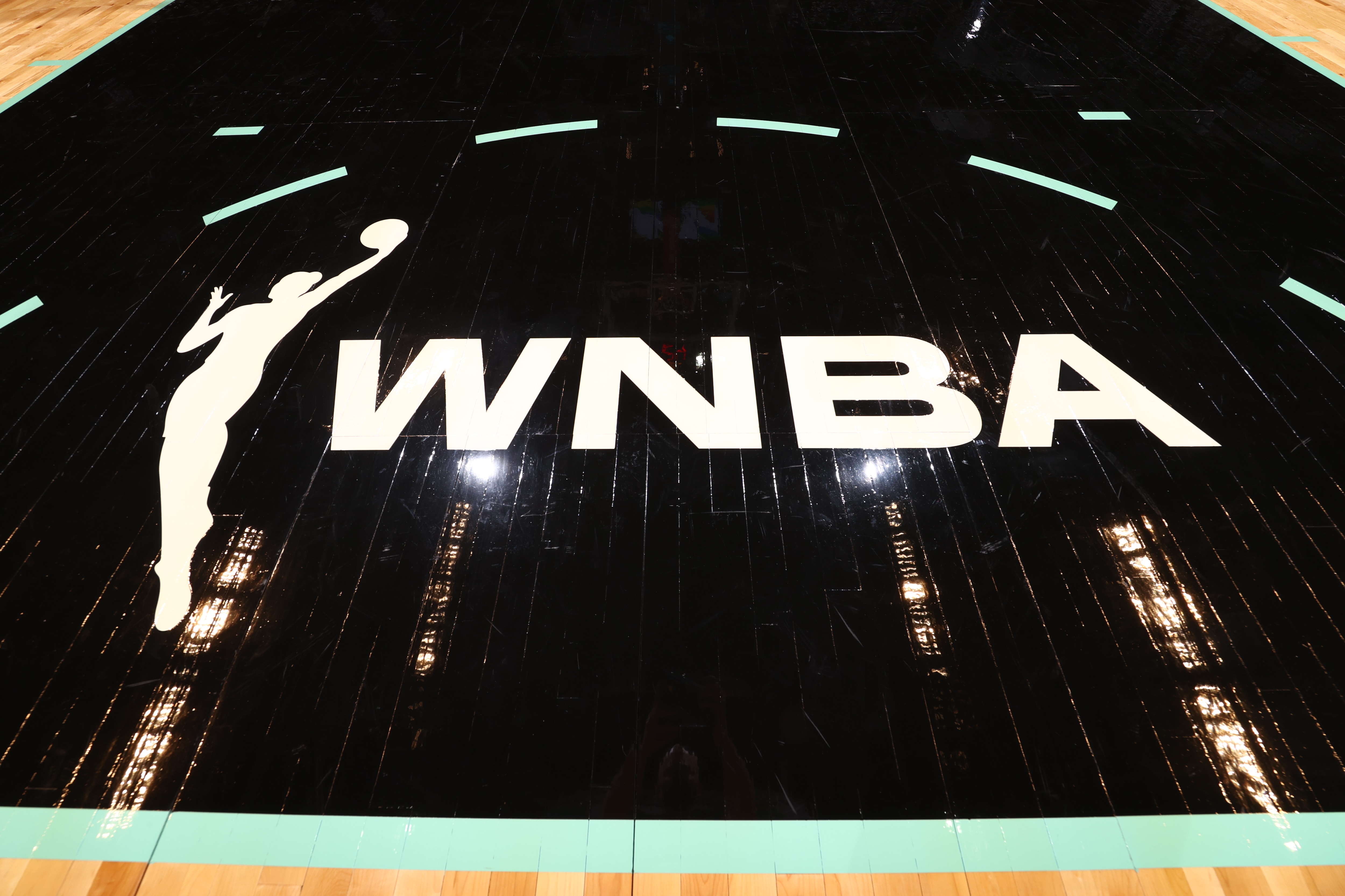 NEW YORK, NY - JUNE 24: The WNBA logo is displayed on the court on June 24, 2021 at Barclays Center in New York, NY. NOTE TO USER: User expressly acknowledges and agrees that, by downloading and or using this Photograph, user is consenting to the terms and conditions of the Getty Images License Agreement. Mandatory Copyright Notice: Copyright 2021 NBAE (Photo by Ned Dishman/NBAE via Getty Images)