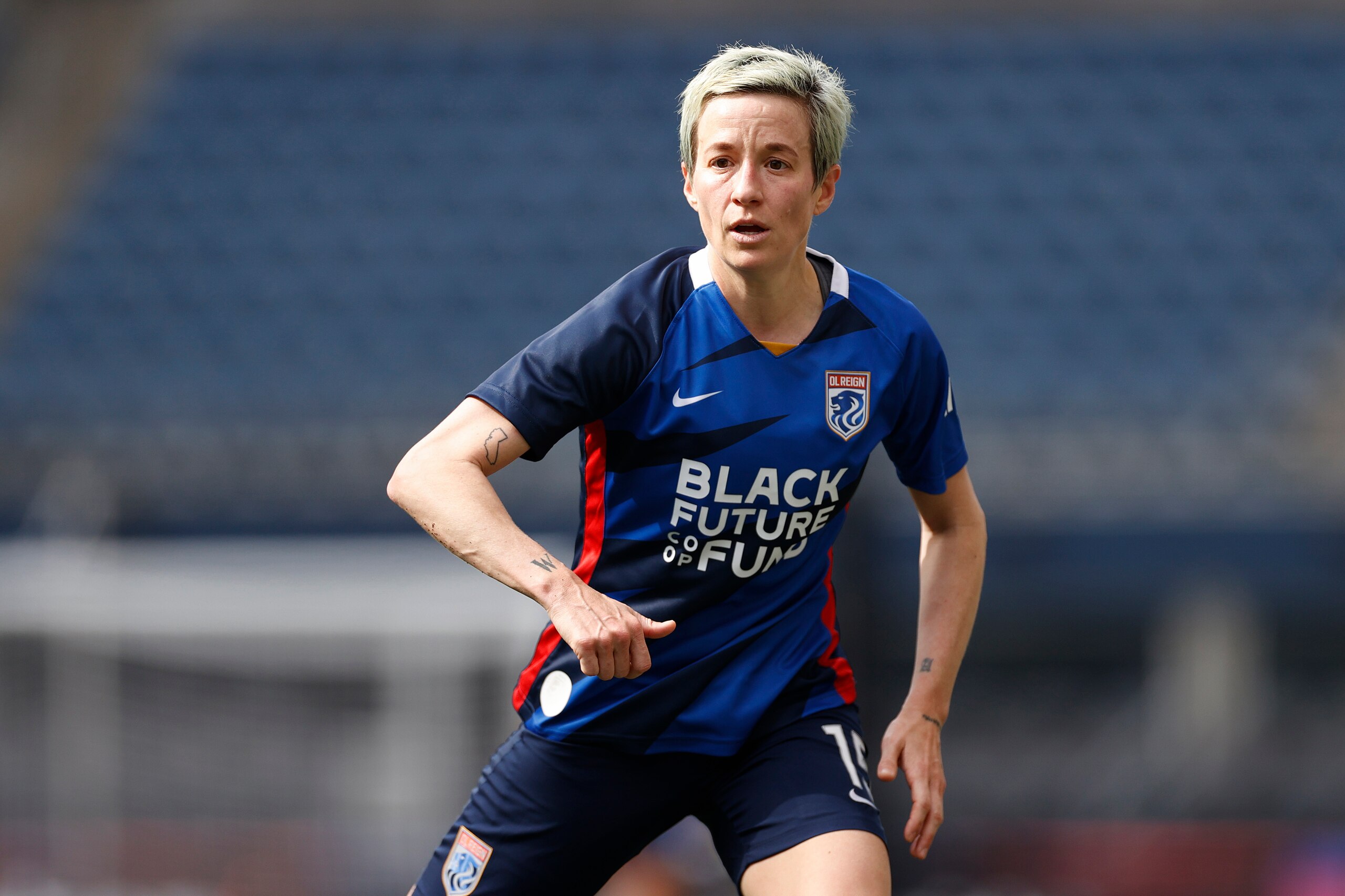 SEATTLE, WASHINGTON - MAY 22: Megan Rapinoe #15 of OL Reign looks on against the Washington Spirit during the second half at Lumen Field on May 22, 2022 in Seattle, Washington. (Photo by Steph Chambers/Getty Images)