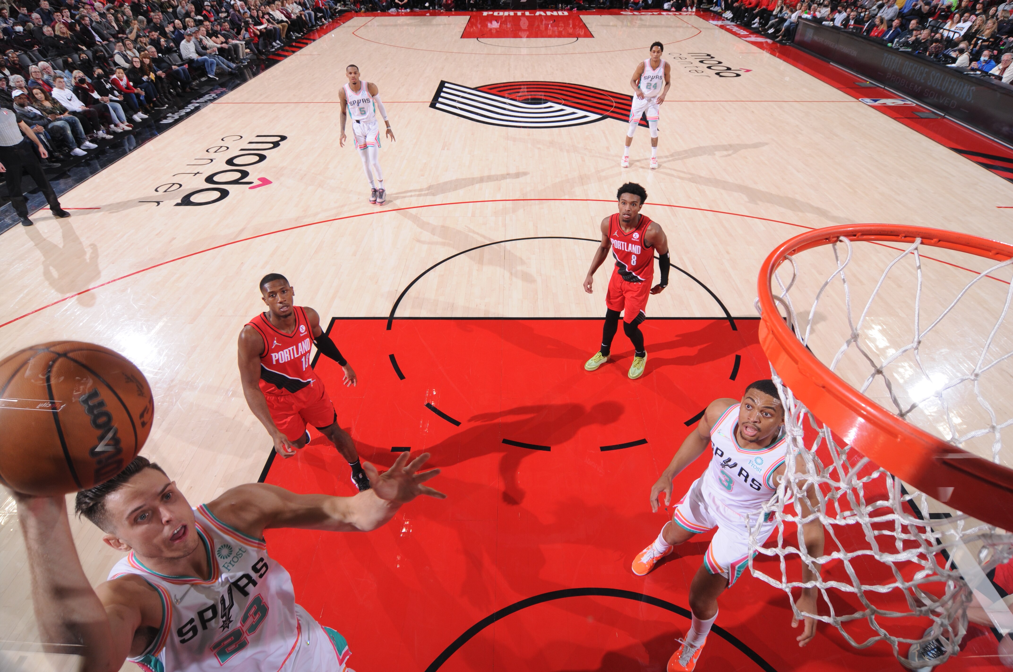PORTLAND, OR - MARCH 23: Zach Collins #23 of the San Antonio Spurs drives to the basket during the game against the Portland Trail Blazers on March 23, 2022 at the Moda Center Arena in Portland, Oregon. NOTE TO USER: User expressly acknowledges and agrees that, by downloading and or using this photograph, user is consenting to the terms and conditions of the Getty Images License Agreement. Mandatory Copyright Notice: Copyright 2022 NBAE (Photo by Sam Forencich/NBAE via Getty Images)