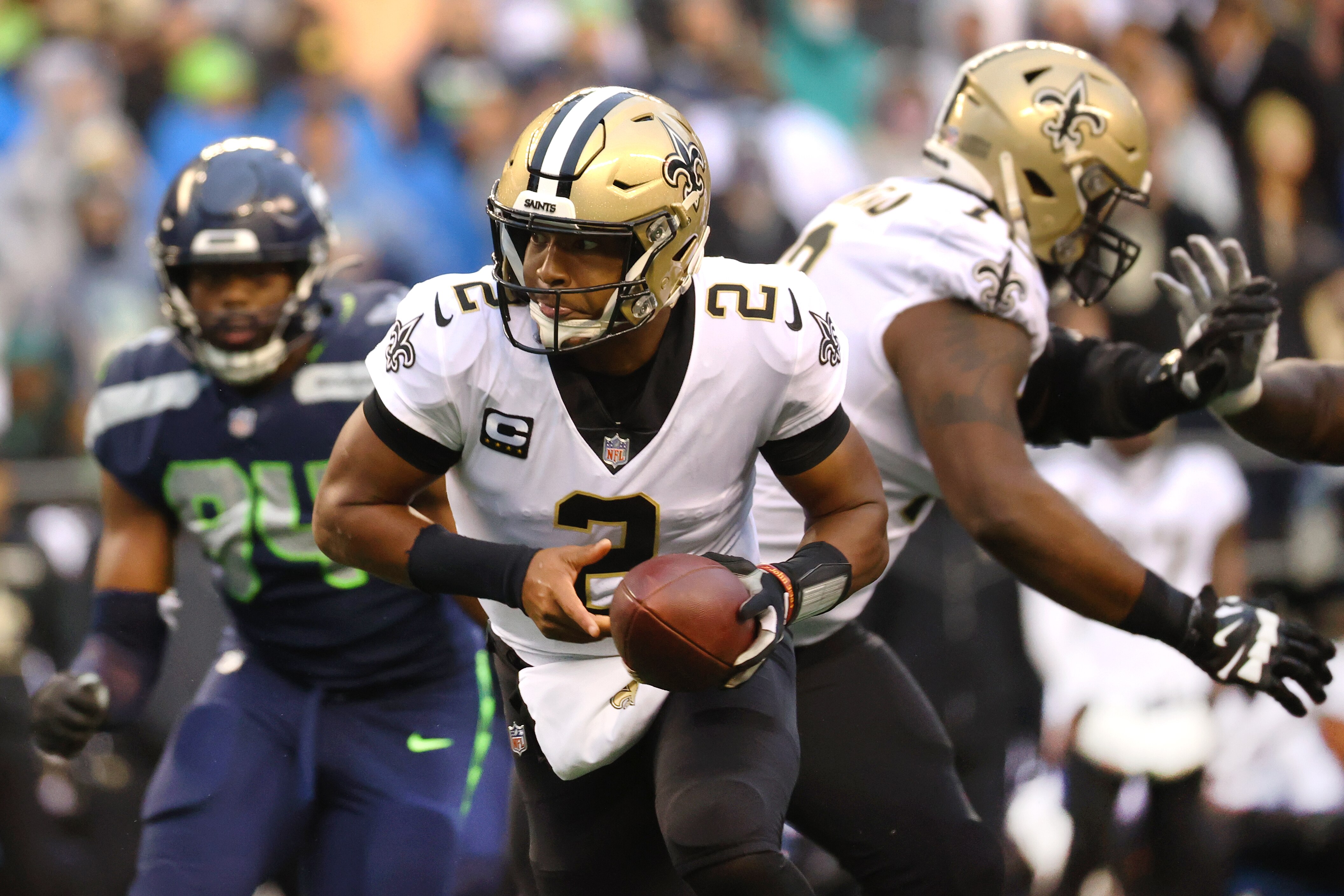 SEATTLE, WASHINGTON - OCTOBER 25: Jameis Winston #2 of the New Orleans Saints looks to hand the ball off against the Seattle Seahawks during the first quarter at Lumen Field on October 25, 2021 in Seattle, Washington. (Photo by Abbie Parr/Getty Images)