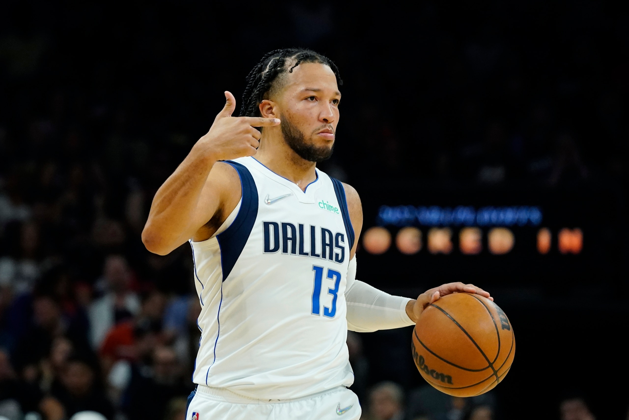 Dallas Mavericks guard Jalen Brunson dribbles the ball against the Phoenix Suns during the first half of Game 5 of an NBA basketball second-round playoff series Tuesday, May 10, 2022, in Phoenix. (AP Photo/Ross D. Franklin)