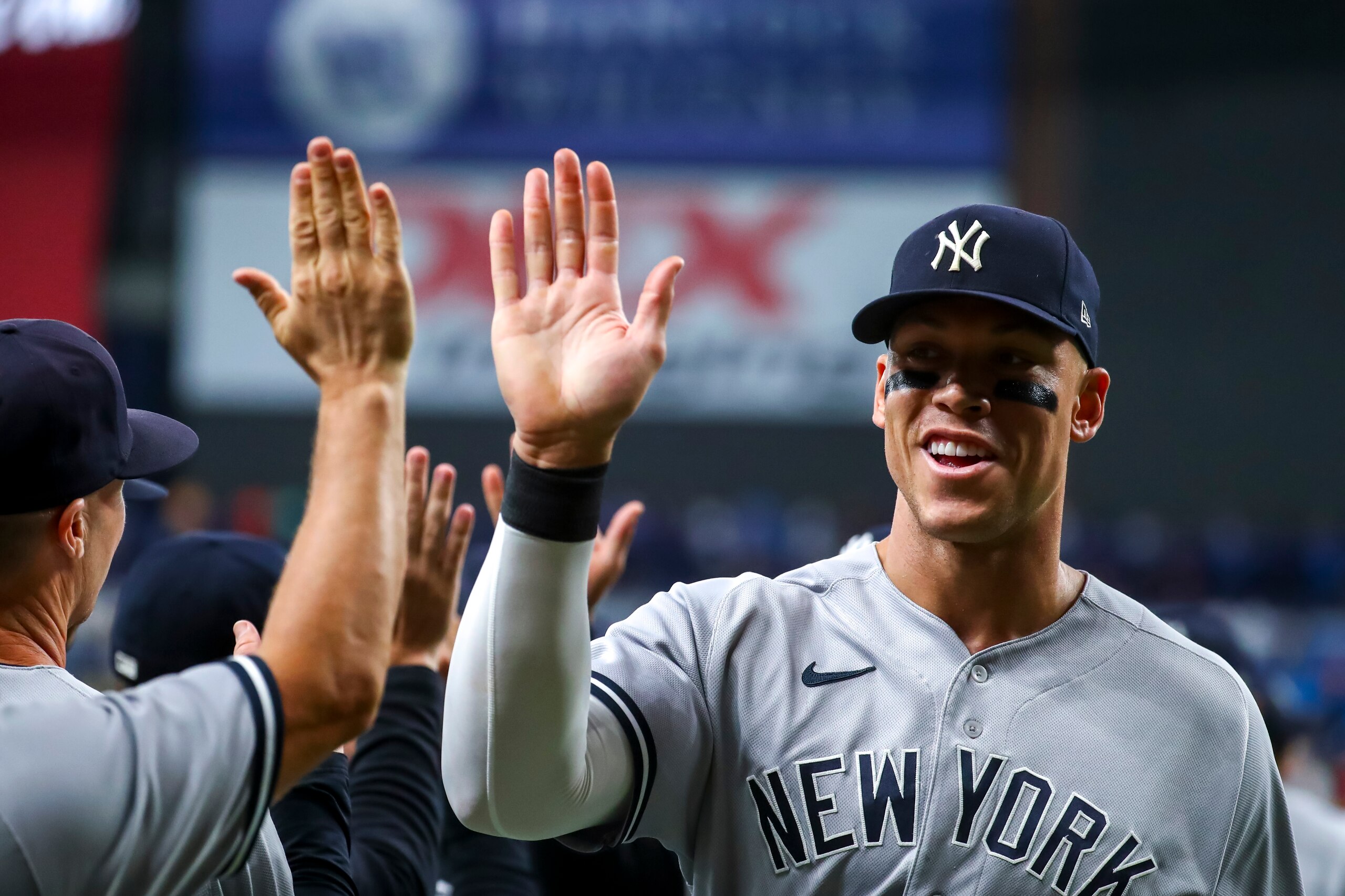 ST PETERSBURG, FL - JUNE 20: Aaron Judge #99 of the New York Yankees high fives teammates after a 4-2 win over the Tampa Bay Rays at Tropicana Field on June 20, 2022 in St Petersburg, Florida. (Photo by Tyler Schank/Getty Images) ST PETERSBURG, FL - JUNE 20: Aaron Judge #99 of the New York Yankees high fives teammates after a 4-2 win over the Tampa Bay Rays at Tropicana Field on June 20, 2022 in St Petersburg, Florida. (Photo by Tyler Schank/Getty Images)