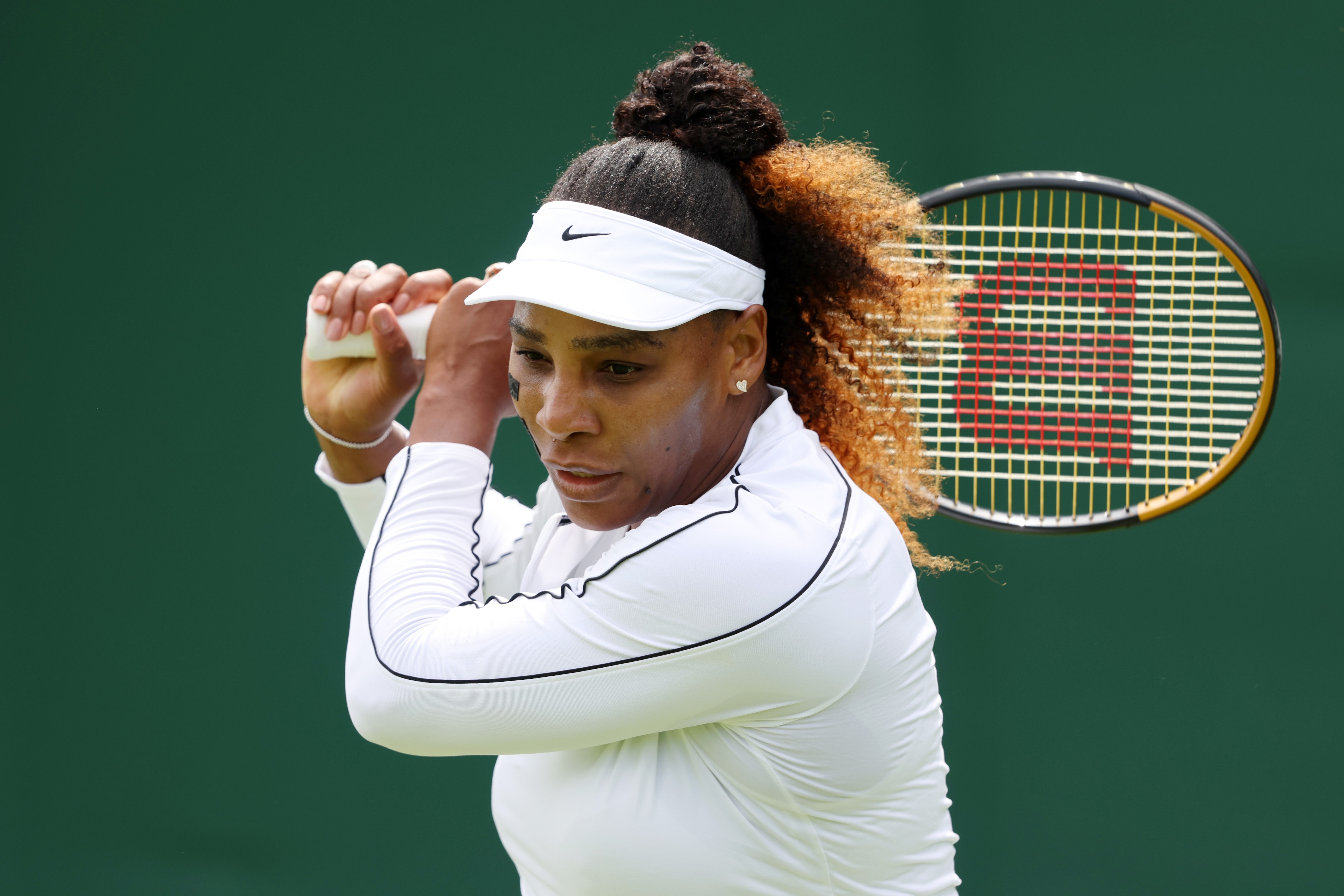 LONDON, ENGLAND - JUNE 25: Serena Williams of The United States plays a backhand during their training session ahead of The Championships Wimbledon 2022 at All England Lawn Tennis and Croquet Club on June 25, 2022 in London, England. (Photo by Clive Brunskill/Getty Images)