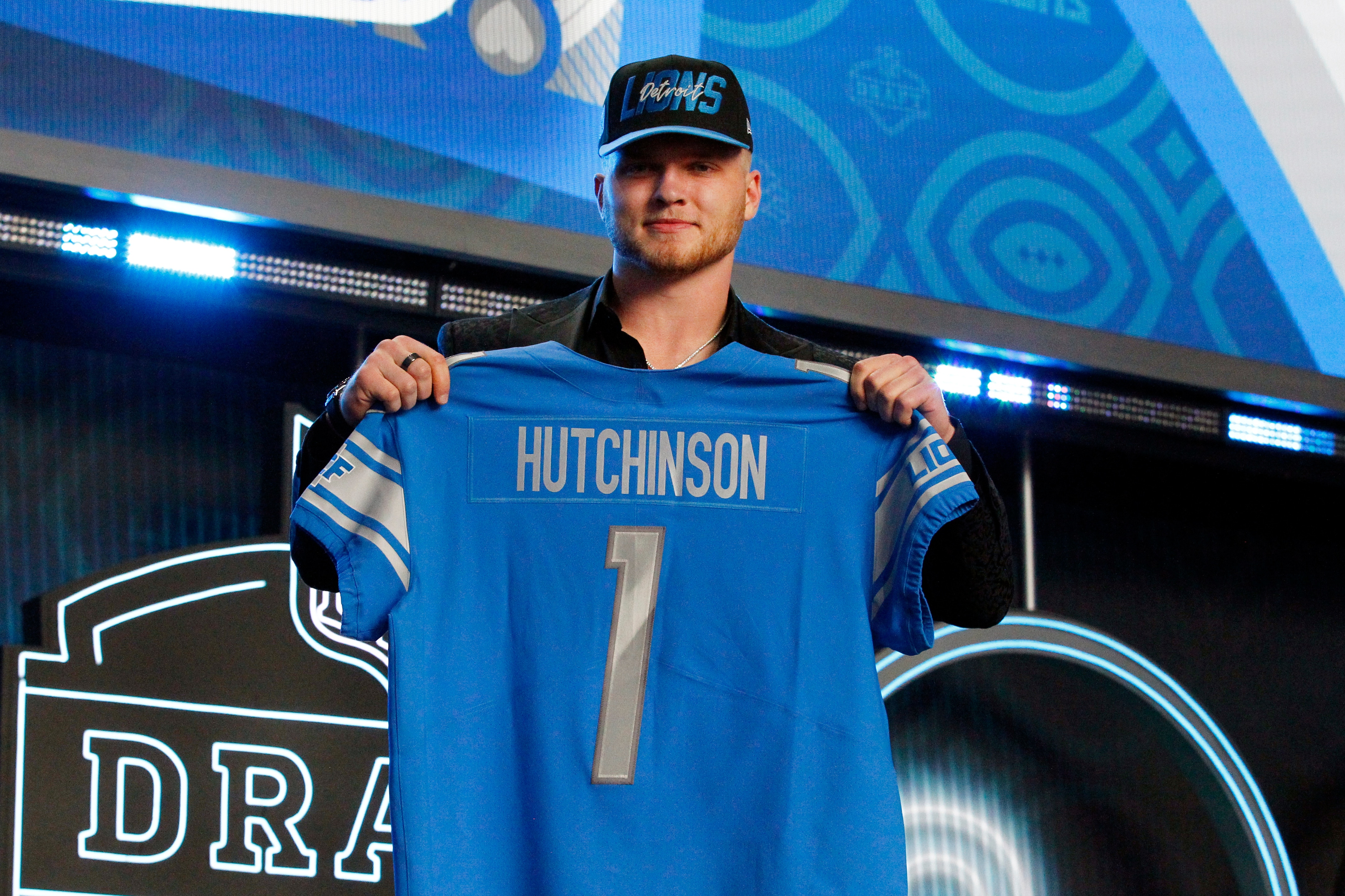 LAS VEGAS, NV - APRIL 28: Aidan Hutchinson, Michigan poses with his jersey as he is selected as the overall number two draft pick by the Detroit Lions during the NFL Draft on April 28, 2022 in Las Vegas, Nevada. (Photo by Jeff Speer/Icon Sportswire via Getty Images)