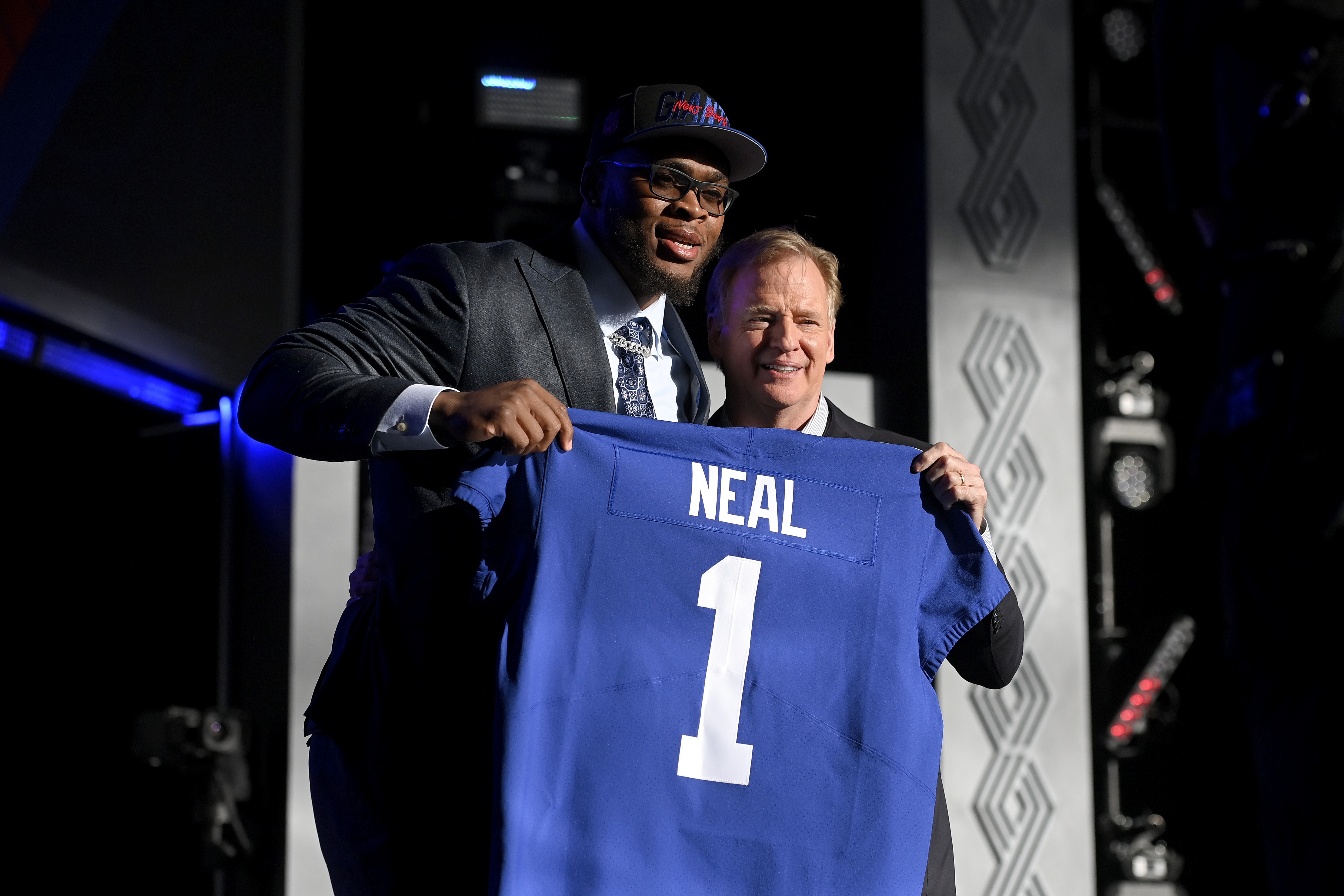 LAS VEGAS, NEVADA - APRIL 28: (L-R) Evan Neal poses with NFL Commissioner Roger Goodell onstage after being selected seventh by the New York Giants during round one of the 2022 NFL Draft on April 28, 2022 in Las Vegas, Nevada. (Photo by David Becker/Getty Images)