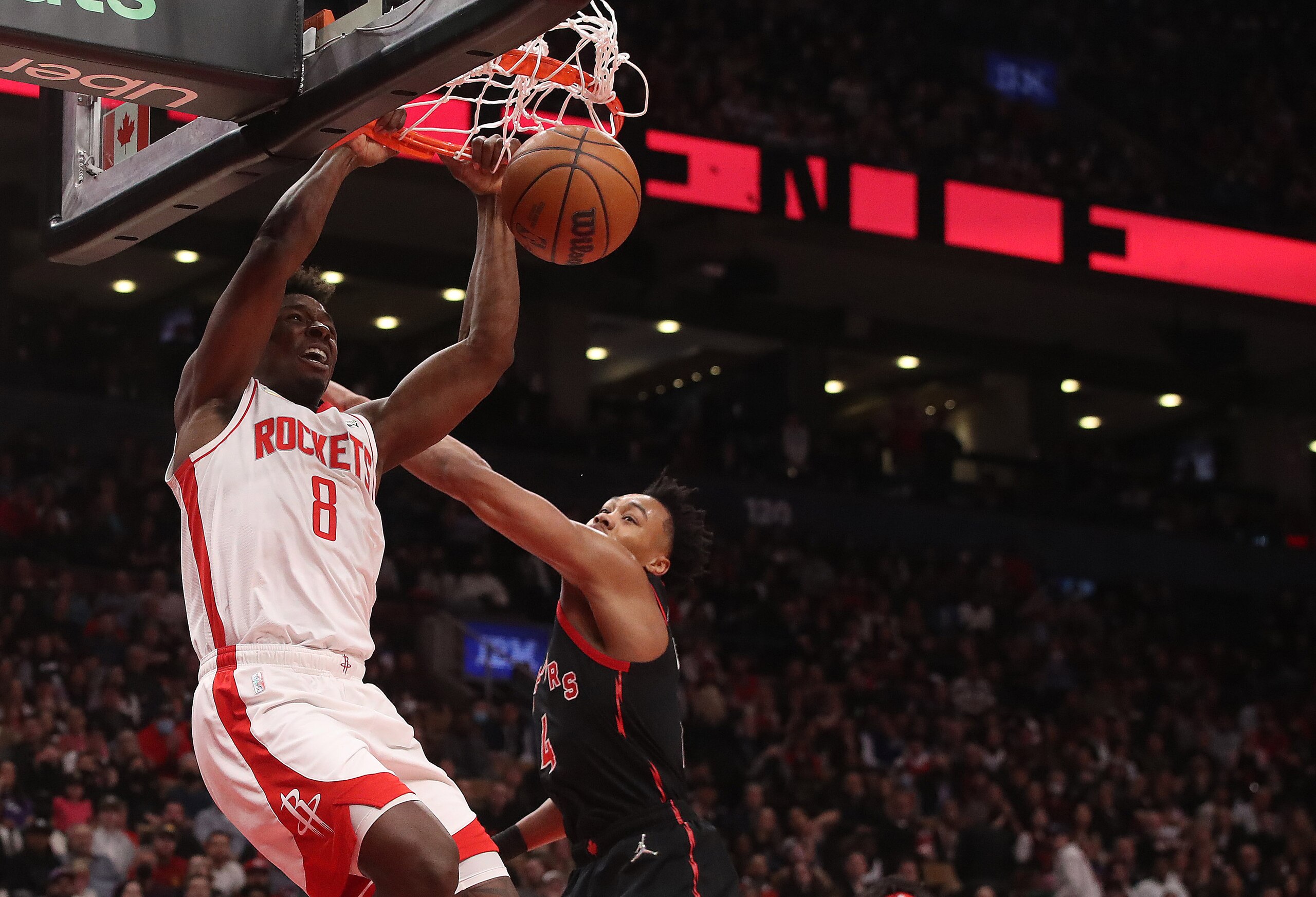 TORONTO, ON- APRIL 8  - Houston Rockets forward Jae'Sean Tate (8) dunks in front of Toronto Raptors forward Scottie Barnes (4) as the Toronto Raptors beat the Houston Rockets 117-115 in Scotiabank Arena in Toronto. April 8, 2022.        (Steve Russell/Toronto Star via Getty Images)