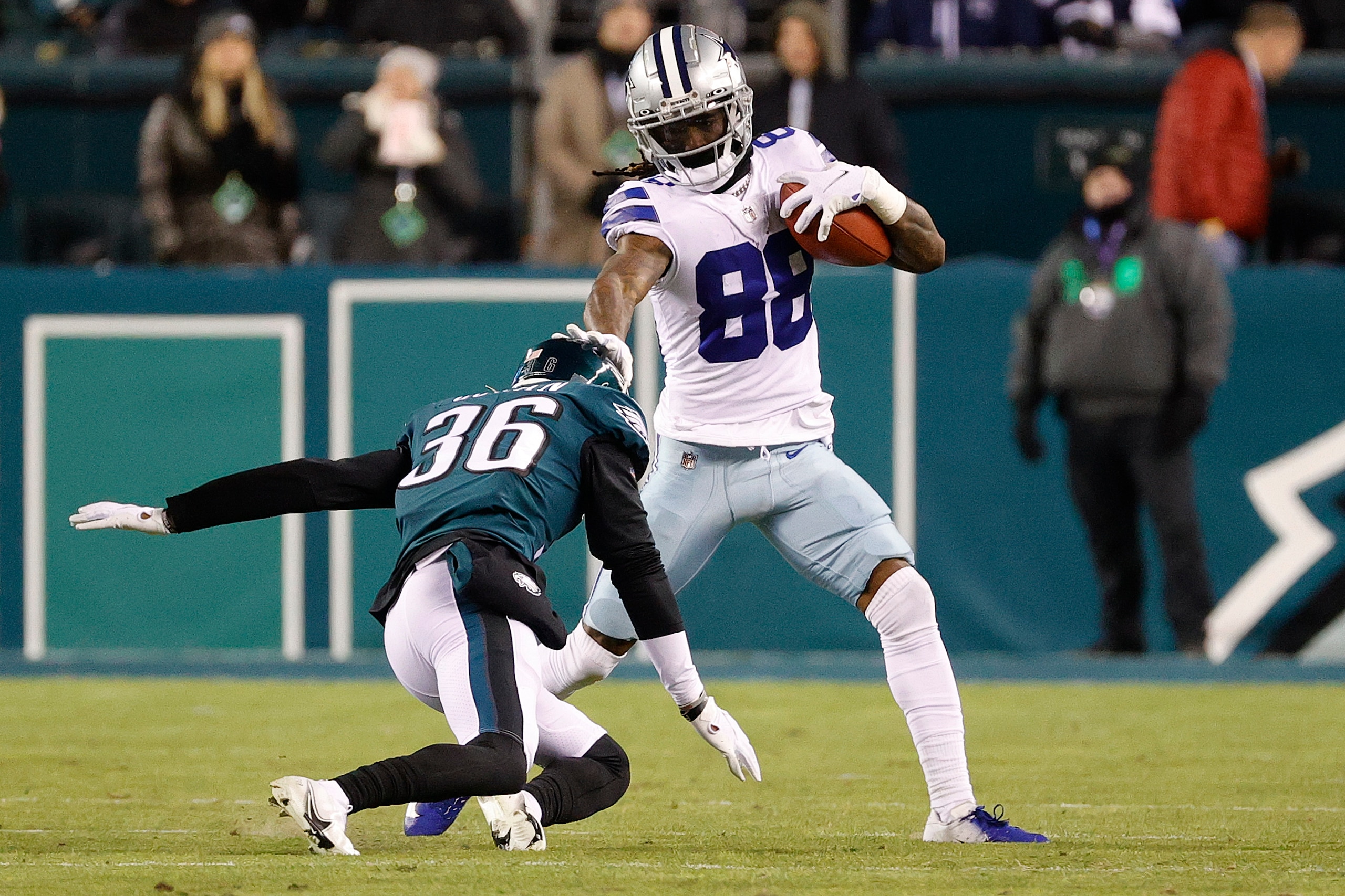 PHILADELPHIA, PENNSYLVANIA - JANUARY 08: CeeDee Lamb #88 of the Dallas Cowboys avoids a tackle from Tay Gowan #36 of the Philadelphia Eagles at Lincoln Financial Field on January 08, 2022 in Philadelphia, Pennsylvania. (Photo by Tim Nwachukwu/Getty Images)