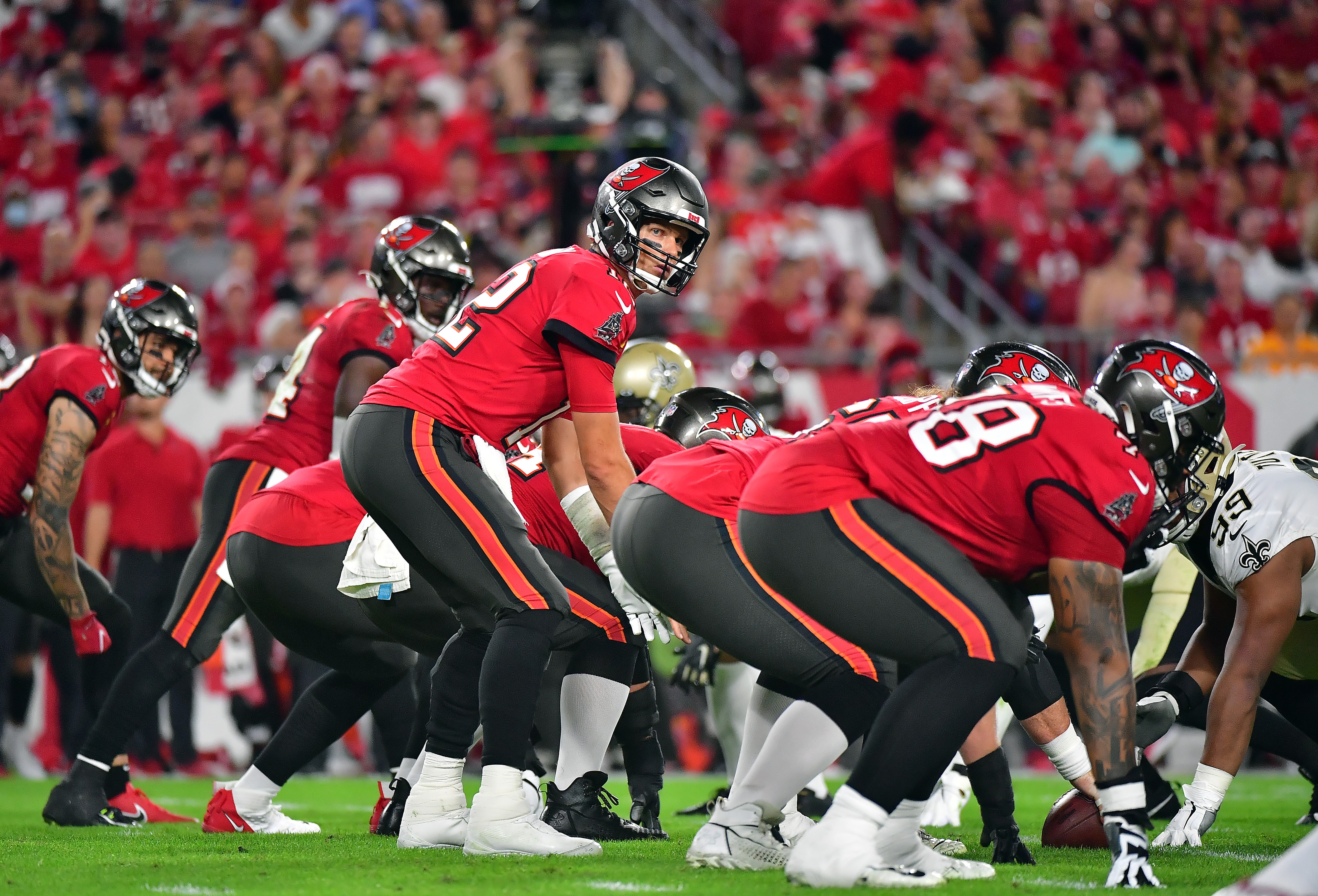 TAMPA, FLORIDA - DECEMBER 19:  Tom Brady #12 of the Tampa Bay Buccaneers in action during the 2nd quarter of the game against the New Orleans Saints at Raymond James Stadium on December 19, 2021 in Tampa, Florida. (Photo by Julio Aguilar/Getty Images)