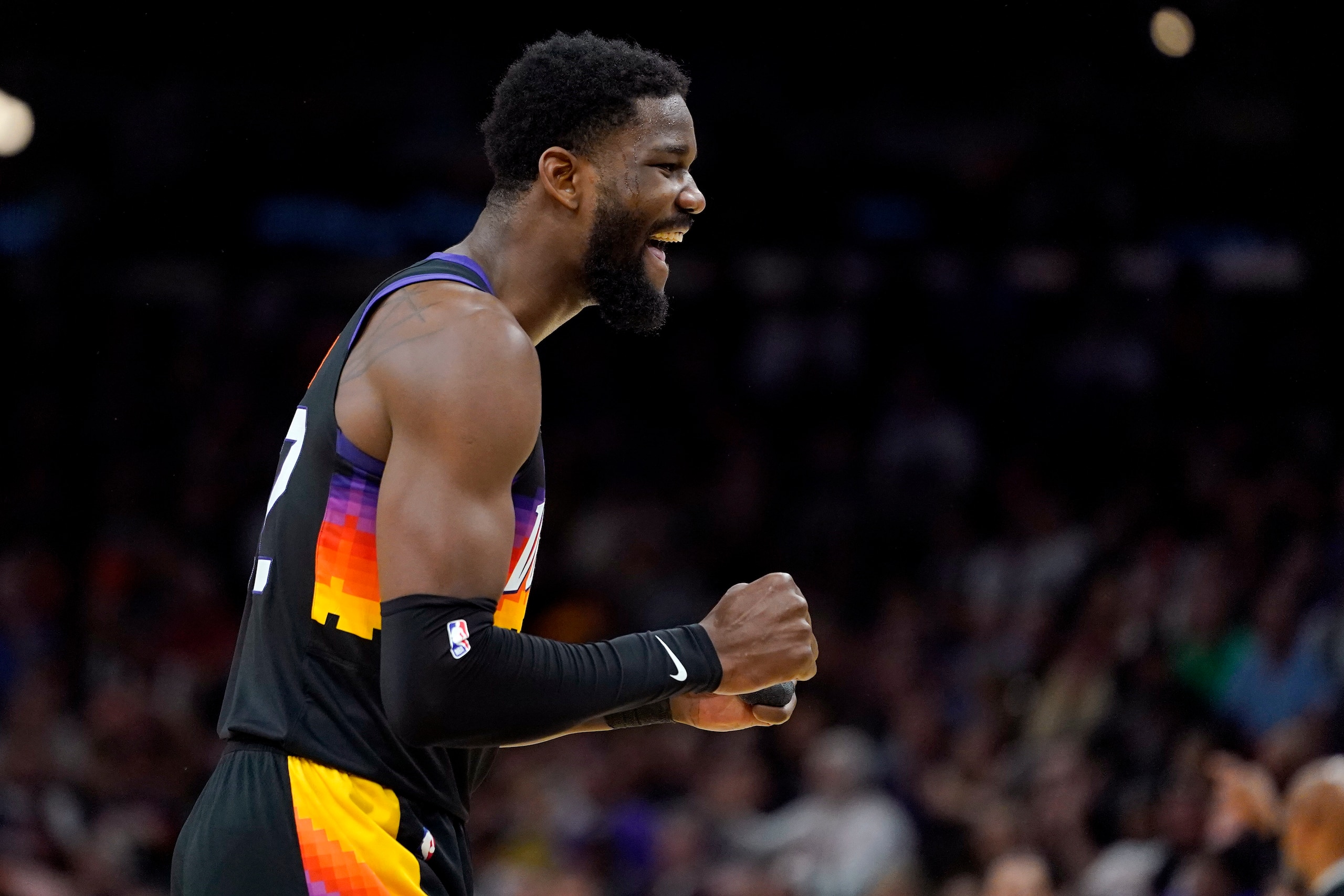 Phoenix Suns center Deandre Ayton reacts to making a basket against the New Orleans Pelicans during the first half of Game 5 of an NBA basketball first-round playoff series, Tuesday, April 26, 2022, in Phoenix. (AP Photo/Matt York)