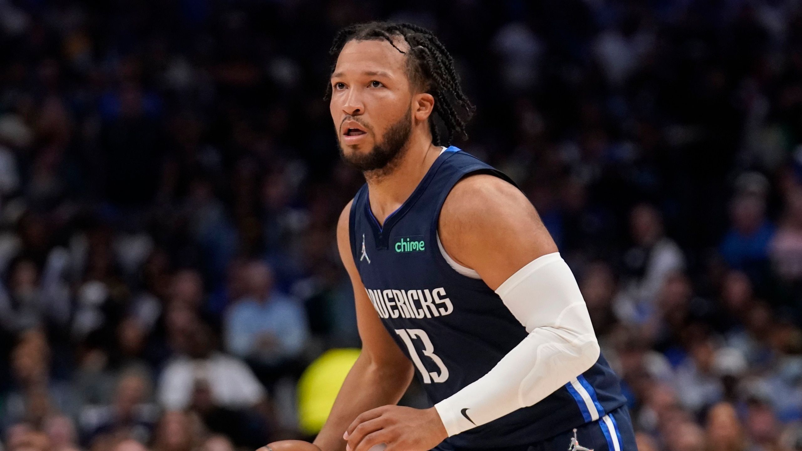 Dallas Mavericks guard Jalen Brunson (13) drives up court during the first half against the Golden State Warriors in Game 3 of the NBA basketball playoffs Western Conference finals, Sunday, May 22, 2022, in Dallas. (AP Photo/Tony Gutierrez)