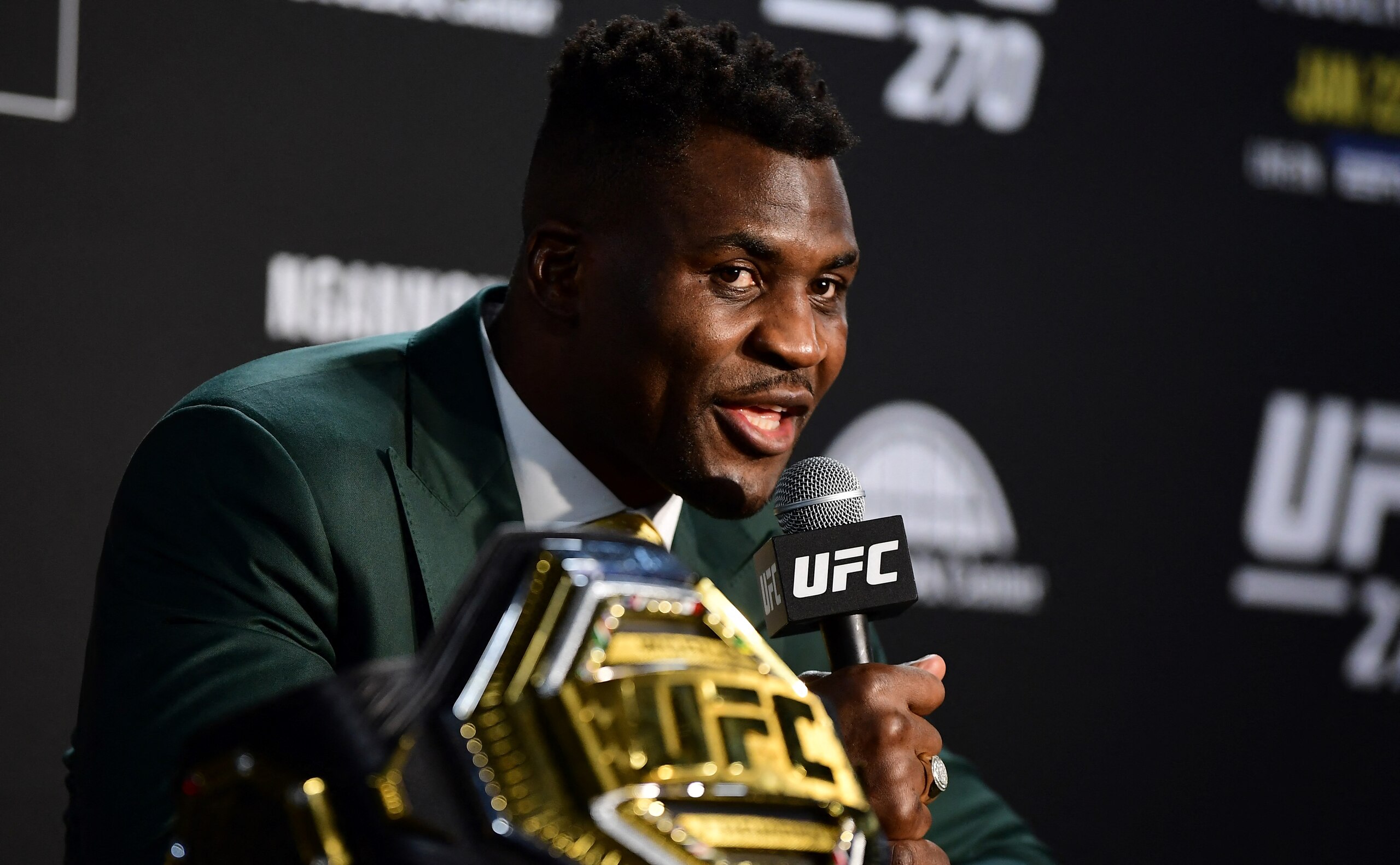 Champion Cameroon's Francis Ngannou takes questions in the press room after defeating French Cyril Gane in their UFC 270 championship fight in Anaheim on January 22, 2022. (Photo by Frederic J. BROWN / AFP) (Photo by FREDERIC J. BROWN/AFP via Getty Images)