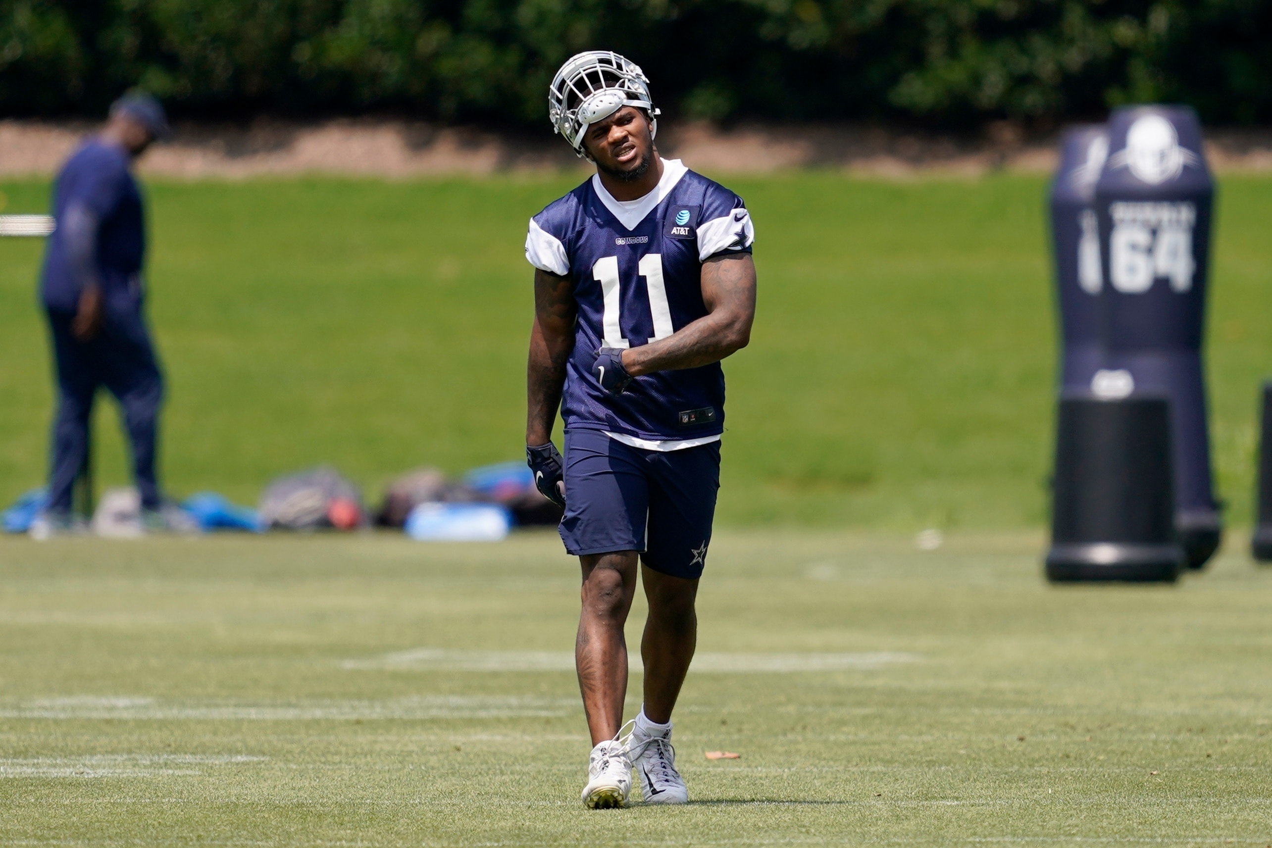 Dallas Cowboys' Micah Parsons walks across the field during practice at the teams training facility, Friday, June 10, 2022, in Frisco, Texas. (AP Photo/Tony Gutierrez)