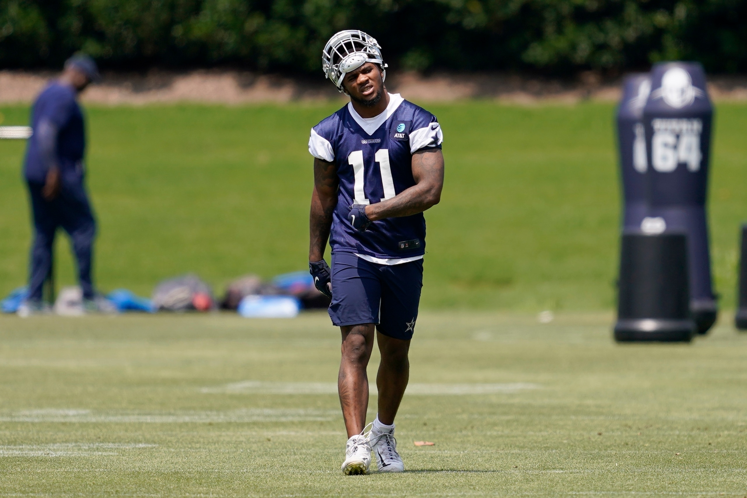 Dallas Cowboys' Micah Parsons walks across the field during practice at the teams training facility, Friday, June 10, 2022, in Frisco, Texas. (AP Photo/Tony Gutierrez)