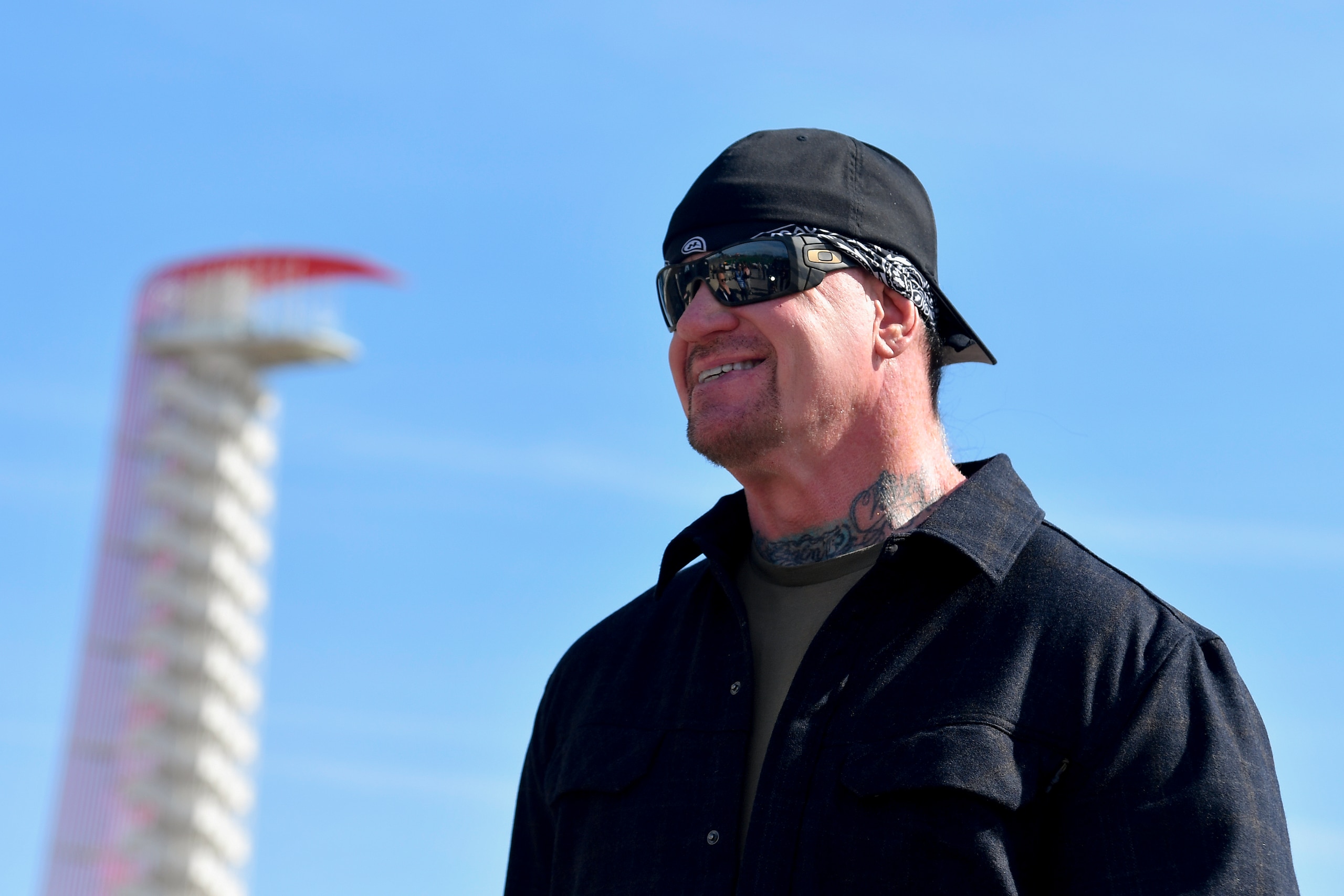 AUSTIN, TEXAS - MARCH 27: Professional wrestler The Undertaker posse for a photo prior to his pace car practice ride for the NASCAR Cup Series Echopark Automotive Grand Prix at Circuit of The Americas on March 27, 2022 in Austin, Texas. (Photo by Logan Riely/Getty Images)