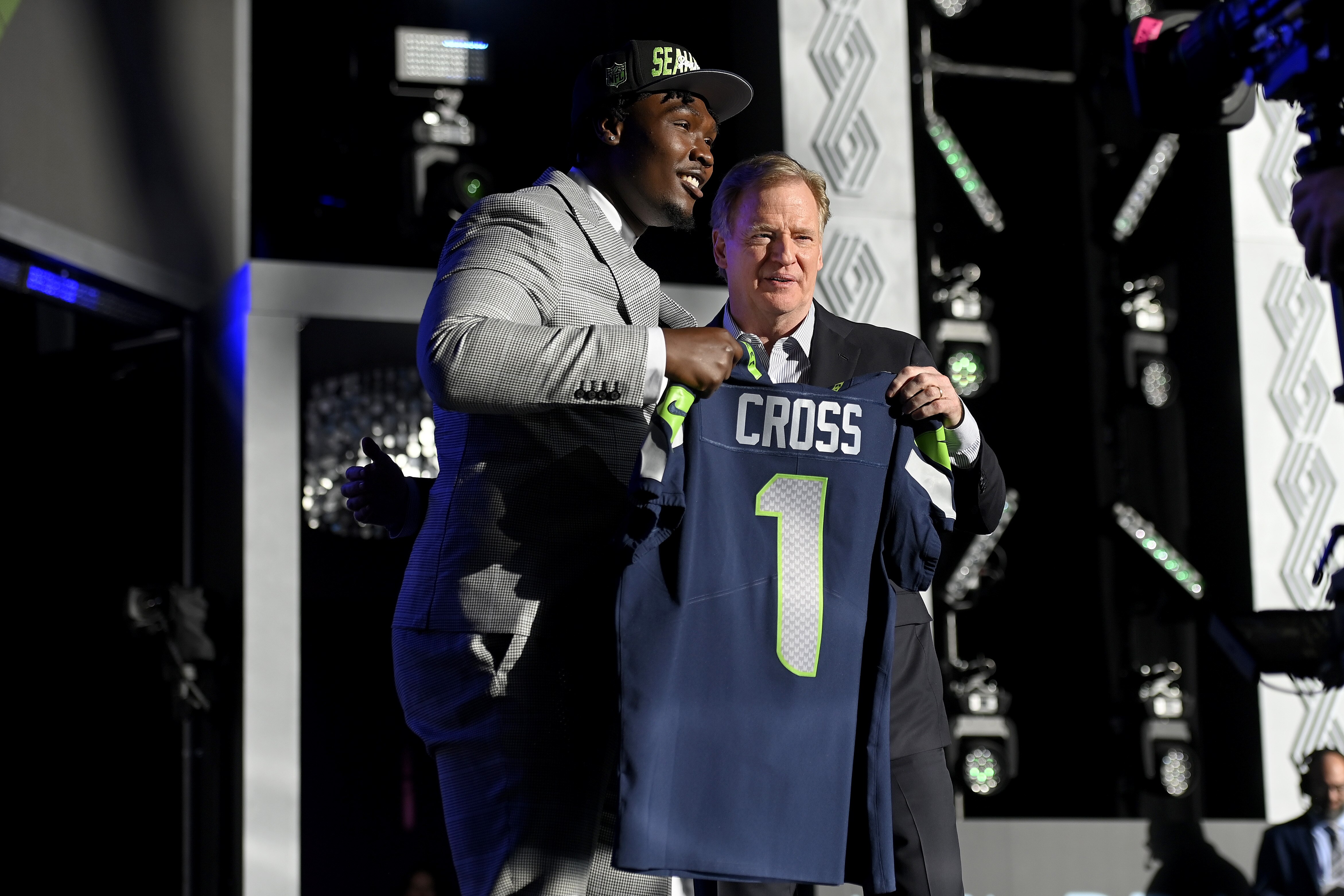 LAS VEGAS, NEVADA - APRIL 28: (L-R) Charles Cross poses with NFL Commissioner Roger Goodell onstage after being selected ninth by the Seattle Seahawks during round one of the 2022 NFL Draft on April 28, 2022 in Las Vegas, Nevada. (Photo by David Becker/Getty Images)