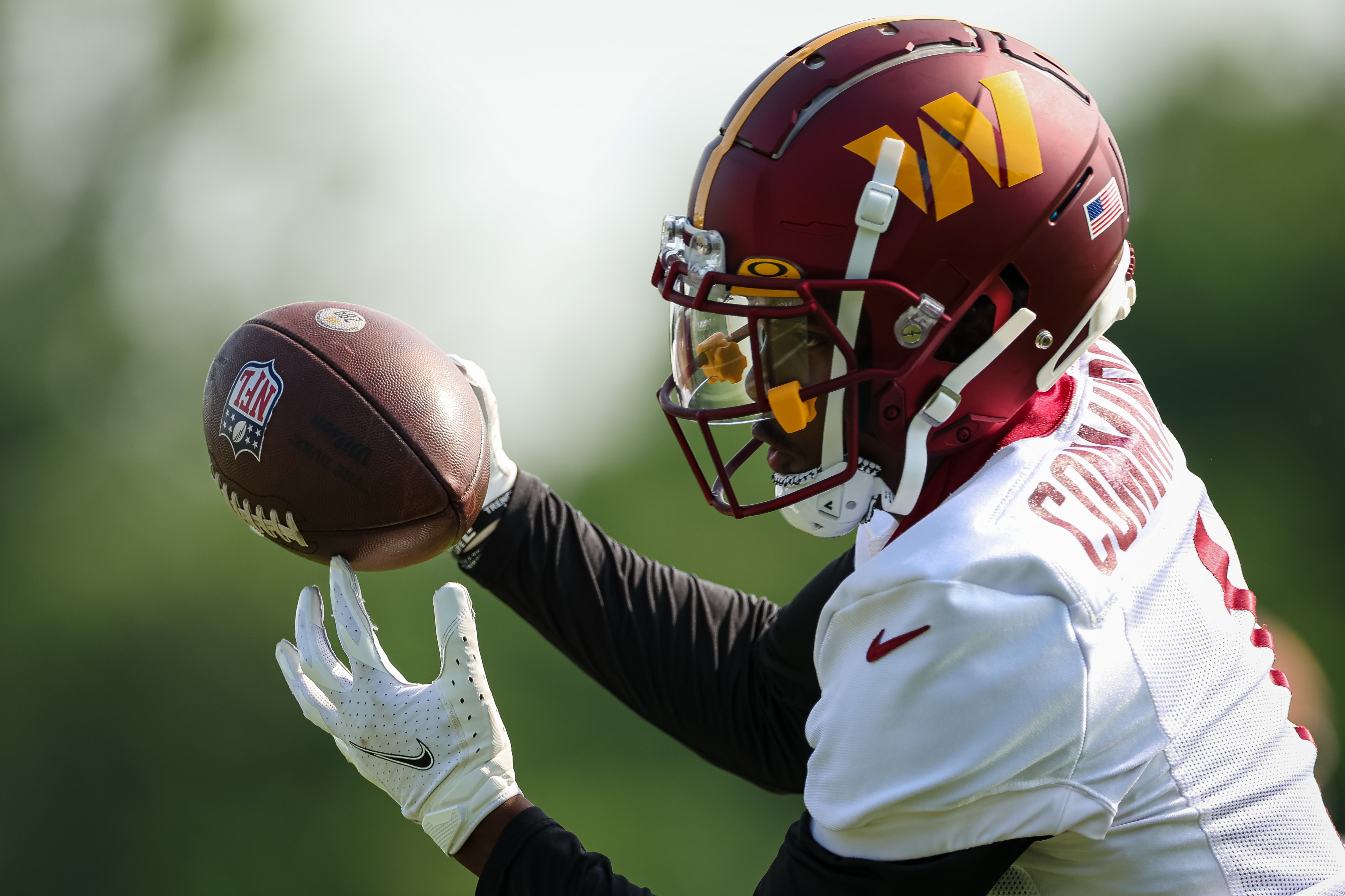 ASHBURN, VA - JUNE 16: Jahan Dotson #1 of the Washington Commanders catches a pass during the organized team activity at INOVA Sports Performance Center on June 16, 2022 in Ashburn, Virginia. (Photo by Scott Taetsch/Getty Images)