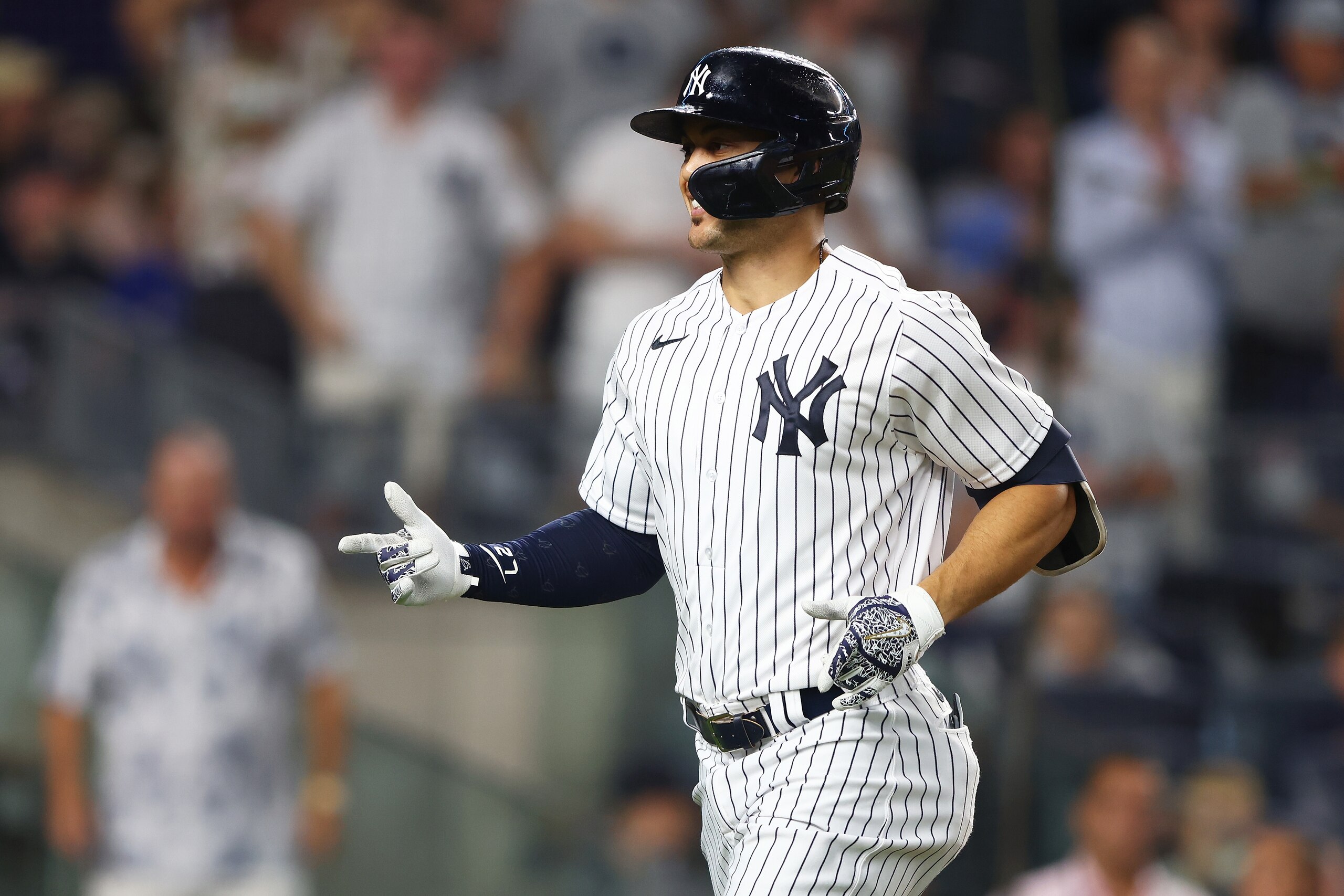 NEW YORK, NEW YORK - JUNE 24: Giancarlo Stanton #27 of the New York Yankees reacts after hitting a home run to right field in the sixth inning against the Houston Astros at Yankee Stadium on June 24, 2022 in New York City. (Photo by Mike Stobe/Getty Images)