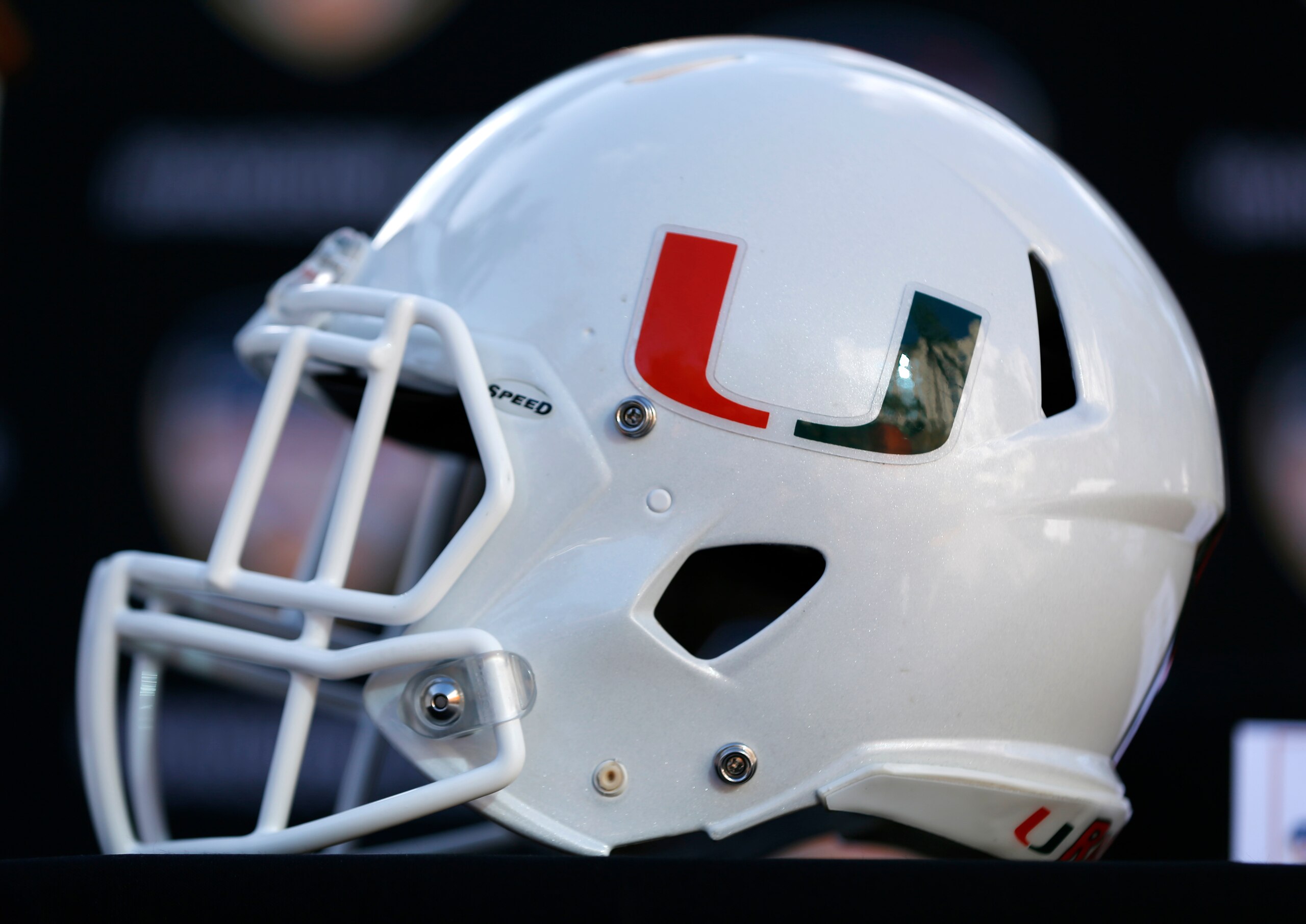 A Miami football helmet is shown before a news conference, Wednesday, Dec. 6, 2017 in Hollywood, Fla. Wisconsin will play Miami Dec. 30 in the Orange Bowl at Hard Rock Stadium in Miami Gardens, Fla. (AP Photo/Wilfredo Lee)