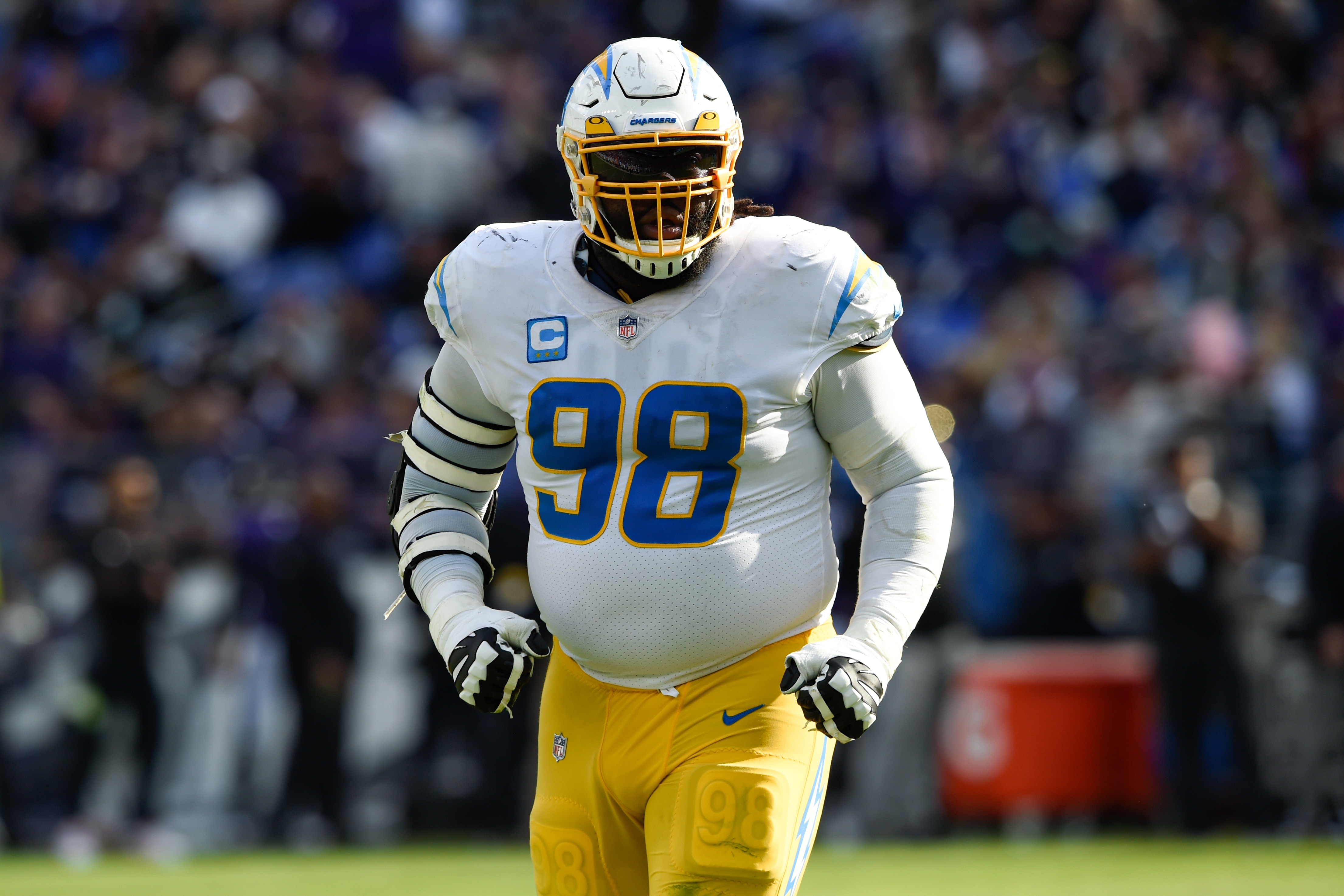 Los Angeles Chargers defensive tackle Linval Joseph runs on the field during the second half of an NFL football game against the Baltimore Ravens, Sunday, Oct. 17, 2021, in Baltimore. The Ravens won 34-6. (AP Photo/Gail Burton)