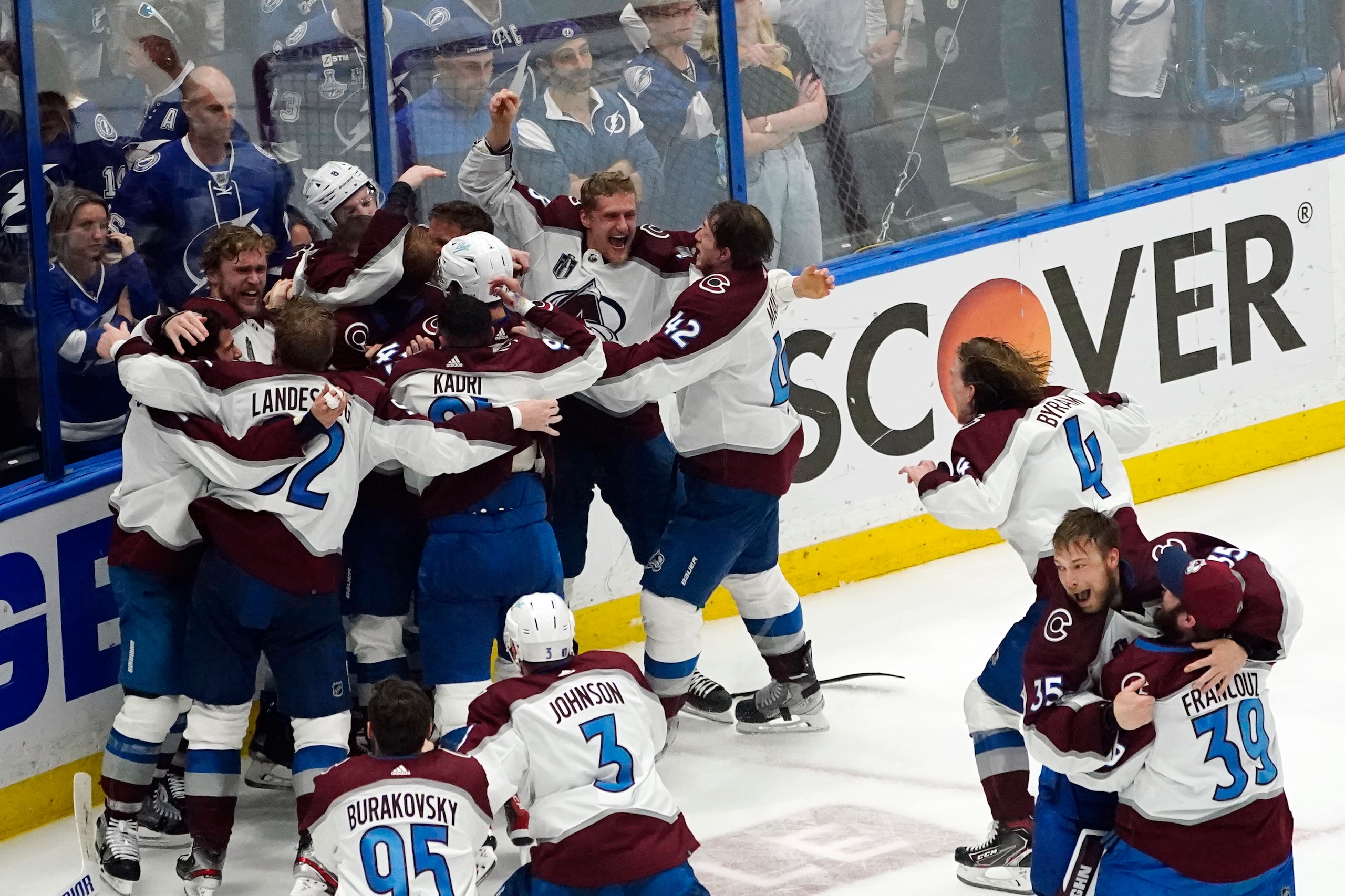 The Colorado Avalanche celebrate after the team defeated the Tampa Bay Lightning in Game 6 of the NHL hockey Stanley Cup Finals on Sunday, June 26, 2022, in Tampa, Fla. The Avalanche won 2-1. (AP Photo/John Bazemore)