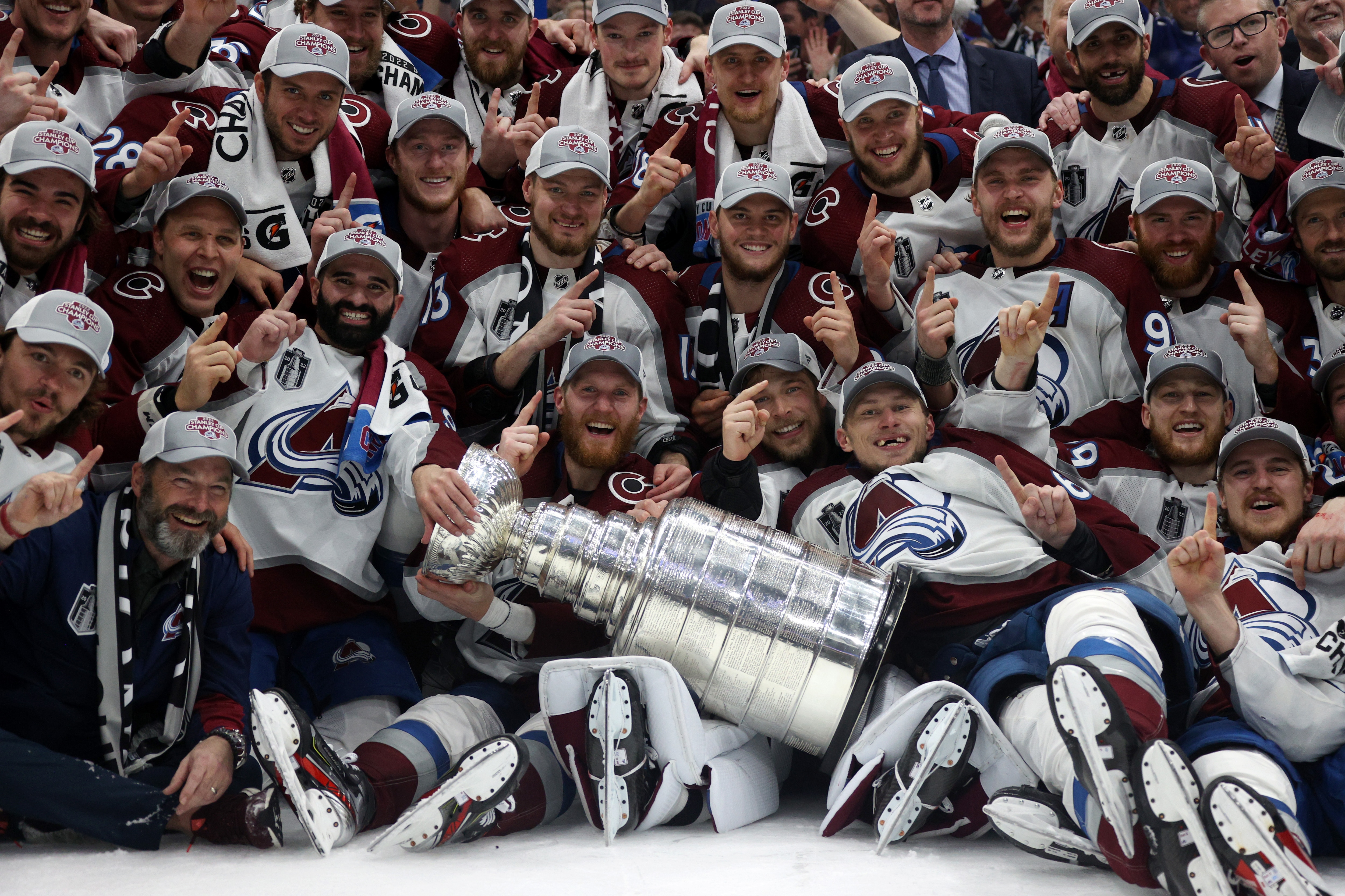 TAMPA, FLORIDA - JUNE 26: The Colorado Avalanche pose for a team photo with the Stanley Cup after defeating the Tampa Bay Lightning in Game Six of the 2022 Stanley Cup Final at Amalie Arena on June 26, 2022 in Tampa, Florida. The Colorado Avalanche defeated the Tampa Bay Lightning 2-1 in Game Six to take the best of seven Stanley Cup Final series 4 games to 2.  (Photo by Dave Sandford/NHLI via Getty Images)