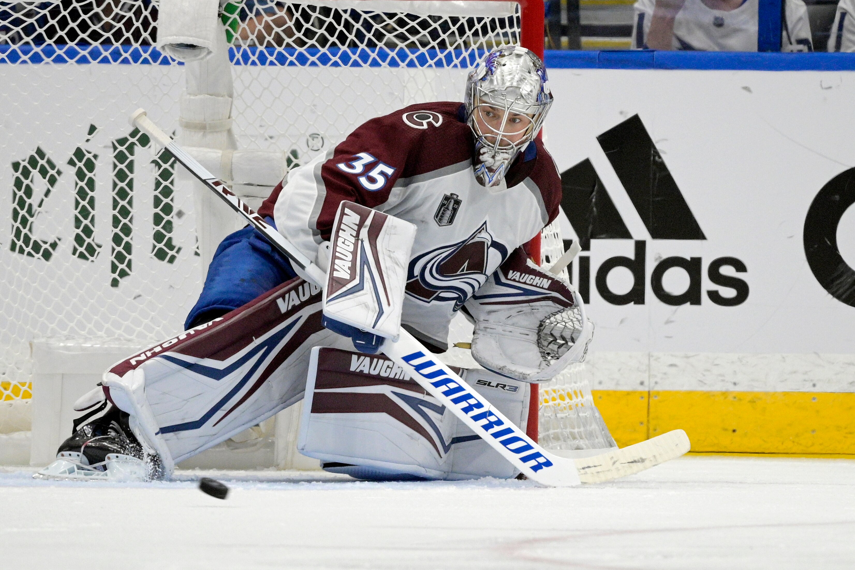 Colorado Avalanche goaltender Darcy Kuemper (35) deflects a puck during the second period of Game 6 of the NHL hockey Stanley Cup Finals against the Tampa Bay Lightning on Sunday, June 26, 2022, in Tampa, Fla. (AP Photo/Phelan Ebenhack)