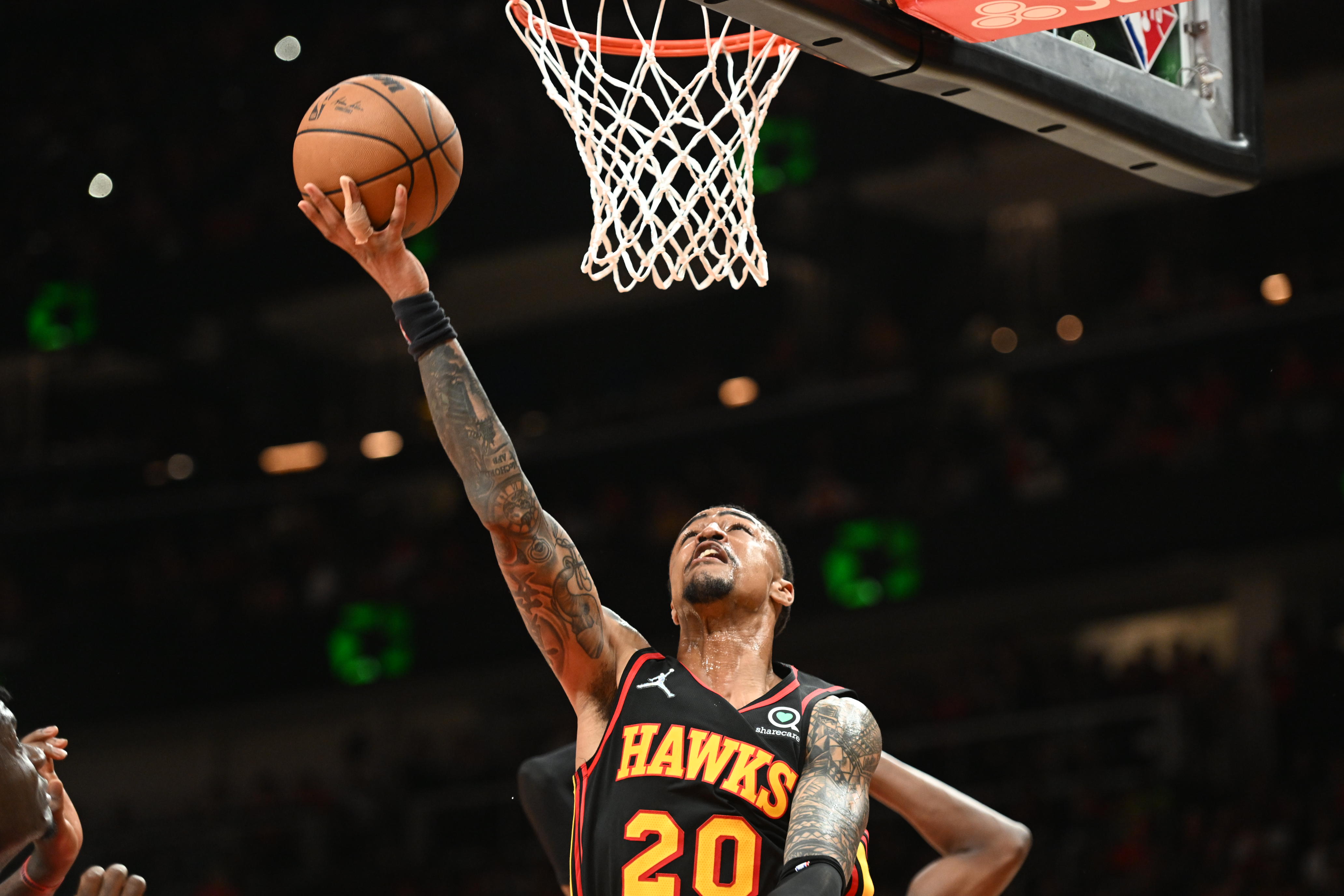 ATLANTA, GA - APRIL 24: John Collins #20 of the Atlanta Hawks shoots the ball against the Miami Heat during Round 1 Game 4 of the 2022 NBA Playoffs on April 24, 2022 at State Farm Arena in Atlanta, Georgia.  NOTE TO USER: User expressly acknowledges and agrees that, by downloading and/or using this Photograph, user is consenting to the terms and conditions of the Getty Images License Agreement. Mandatory Copyright Notice: Copyright 2022 NBAE (Photo by Adam Hagy/NBAE via Getty Images)