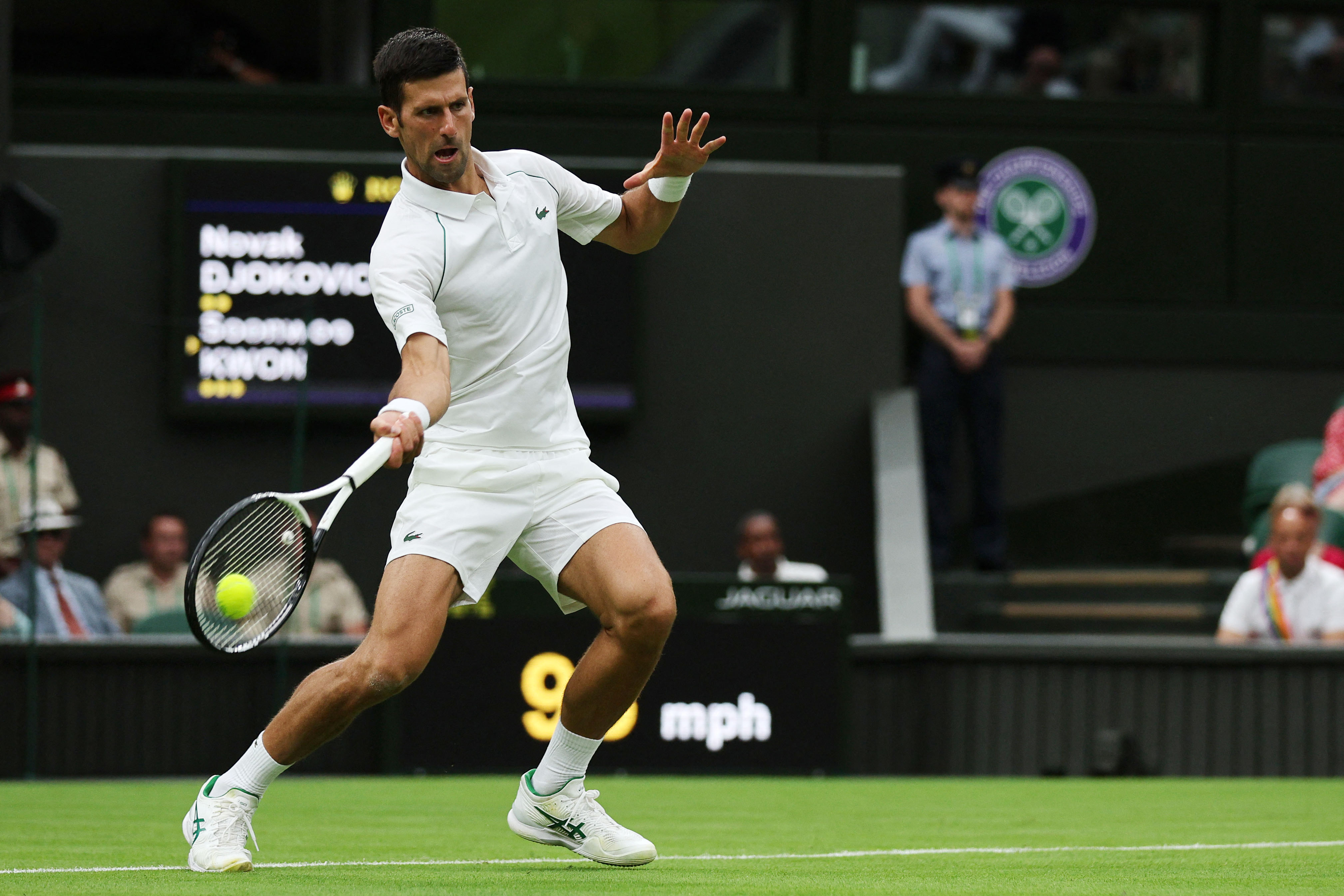 Serbia's Novak Djokovic returns the ball to South Korea's Kwon Soon-woo during their men's singles tennis match on the first day of the 2022 Wimbledon Championships at The All England Tennis Club in Wimbledon, southwest London, on June 27, 2022. - RESTRICTED TO EDITORIAL USE (Photo by Adrian DENNIS / AFP) / RESTRICTED TO EDITORIAL USE (Photo by ADRIAN DENNIS/AFP via Getty Images)