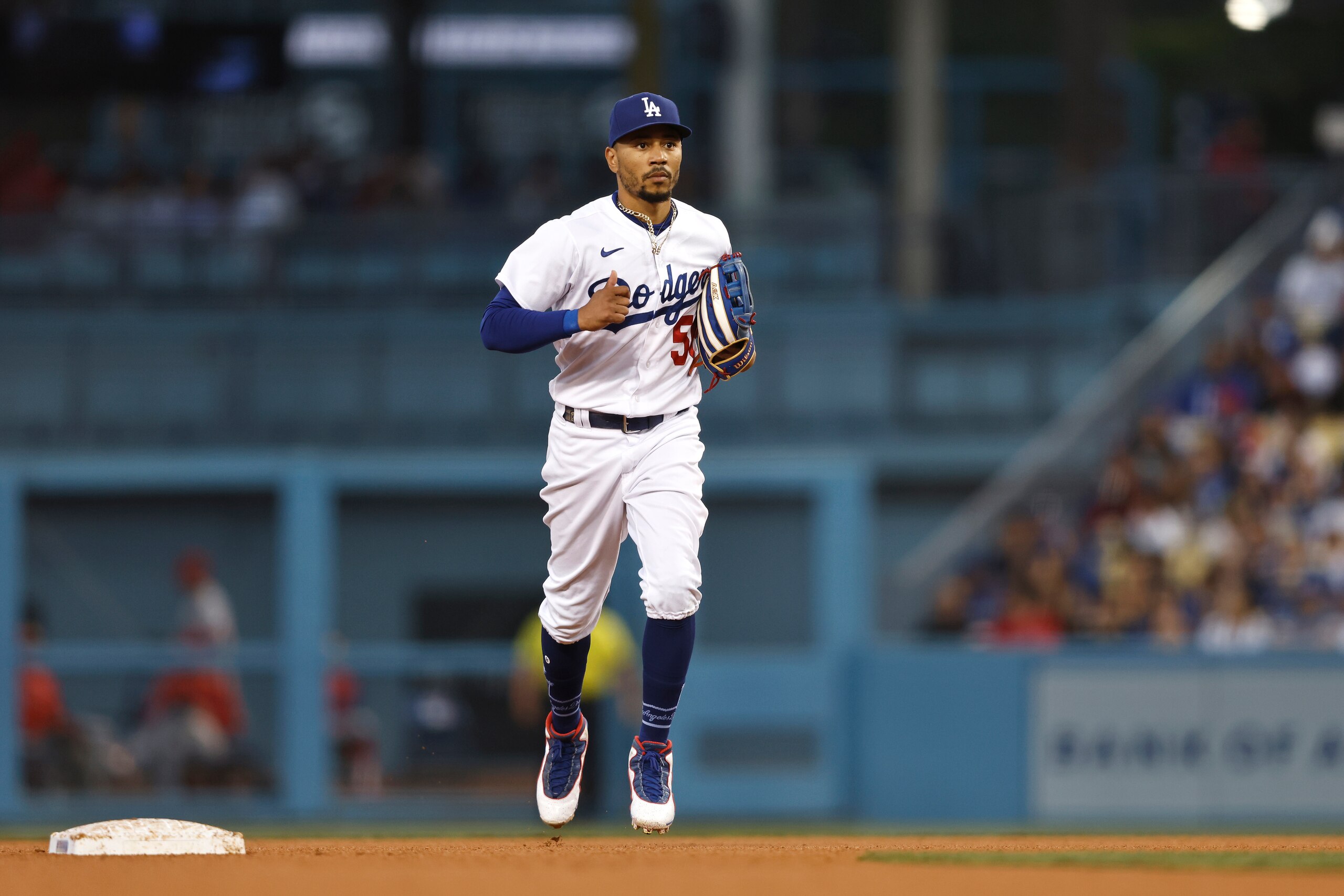 LOS ANGELES, CALIFORNIA - JUNE 15: Mookie Betts #50 of the Los Angeles Dodgers runs to the dugout during a game against the Los Angeles Angels the third inning at Dodger Stadium on June 15, 2022 in Los Angeles, California. (Photo by Michael Owens/Getty Images)