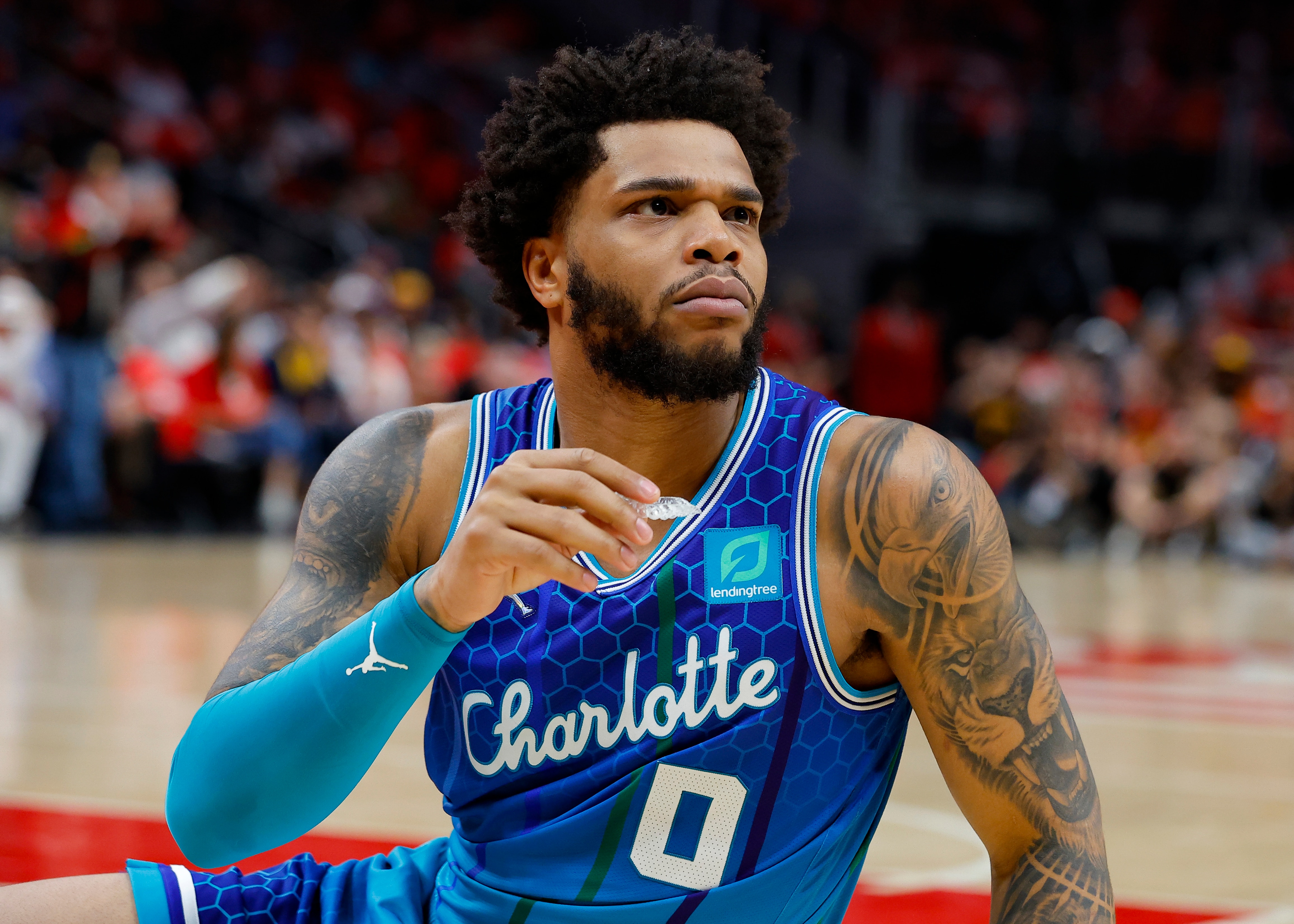 ATLANTA, GA - APRIL 13: Miles Bridges #0 of the Charlotte Hornets reacts after a foul is called during the first half against the Atlanta Hawks at State Farm Arena on April 13, 2022 in Atlanta, Georgia. NOTE TO USER: User expressly acknowledges and agrees that, by downloading and or using this photograph, User is consenting to the terms and conditions of the Getty Images License Agreement. (Photo by Todd Kirkland/Getty Images)