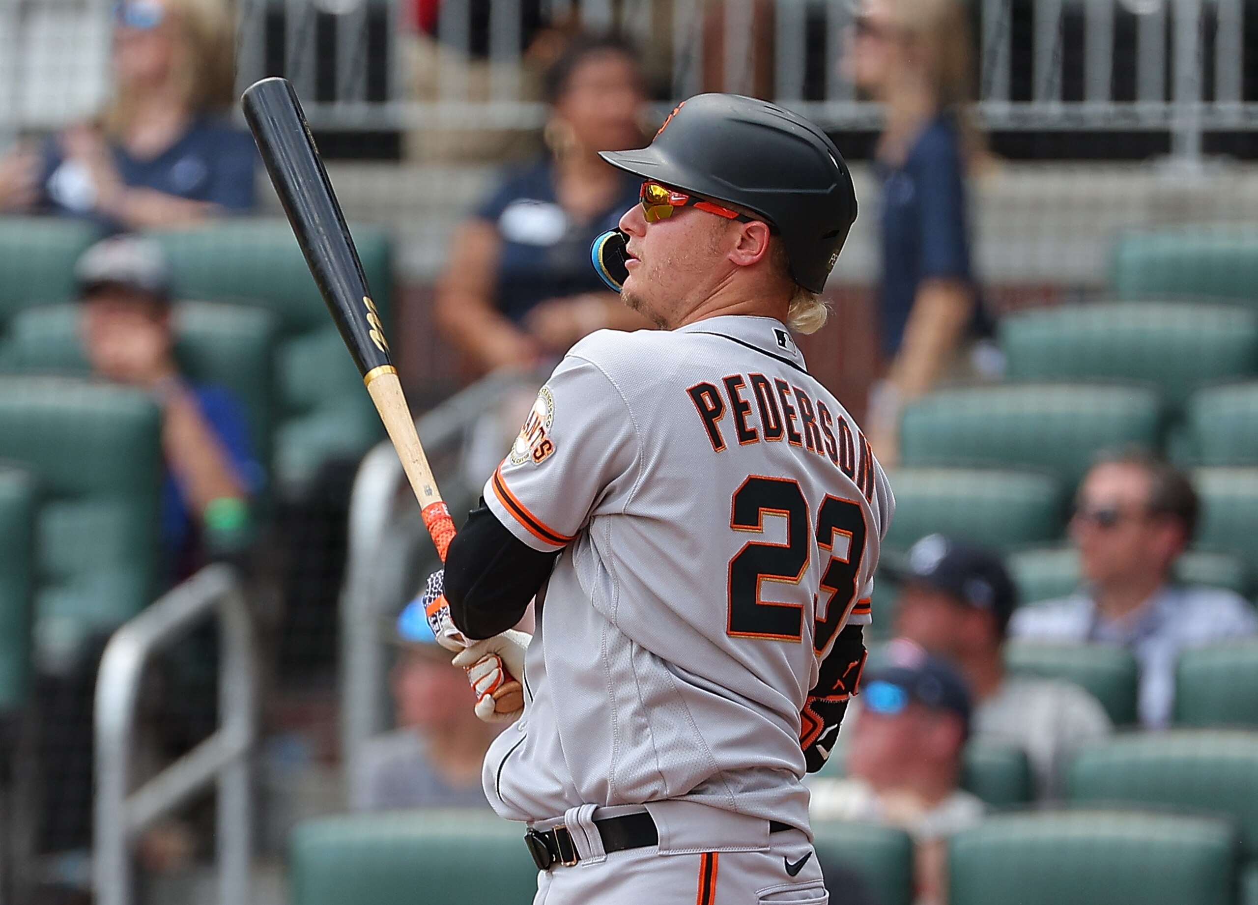 ATLANTA, GEORGIA - JUNE 23:  Joc Pederson #23 of the San Francisco Giants hits a solo homer in the ninth inning against the Atlanta Braves at Truist Park on June 23, 2022 in Atlanta, Georgia. (Photo by Kevin C. Cox/Getty Images)