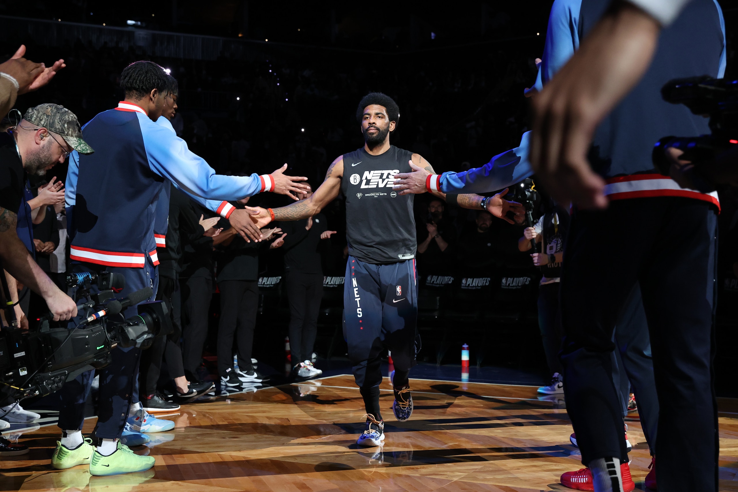BROOKLYN, NY - APRIL 25: Kyrie Irving #11 of the Brooklyn Nets hi-fives teammates before the game against the Boston Celtics during Round 1 Game 4 of the 2022 NBA Playoffs on April 25, 2022 at Barclays Center in Brooklyn, New York. NOTE TO USER: User expressly acknowledges and agrees that, by downloading and or using this Photograph, user is consenting to the terms and conditions of the Getty Images License Agreement. Mandatory Copyright Notice: Copyright 2022 NBAE (Photo by Nathaniel S. Butler/NBAE via Getty Images) BROOKLYN, NY - APRIL 25: Kyrie Irving #11 of the Brooklyn Nets hi-fives teammates before the game against the Boston Celtics during Round 1 Game 4 of the 2022 NBA Playoffs on April 25, 2022 at Barclays Center in Brooklyn, New York. NOTE TO USER: User expressly acknowledges and agrees that, by downloading and or using this Photograph, user is consenting to the terms and conditions of the Getty Images License Agreement. Mandatory Copyright Notice: Copyright 2022 NBAE (Photo by Nathaniel S. Butler/NBAE via Getty Images)