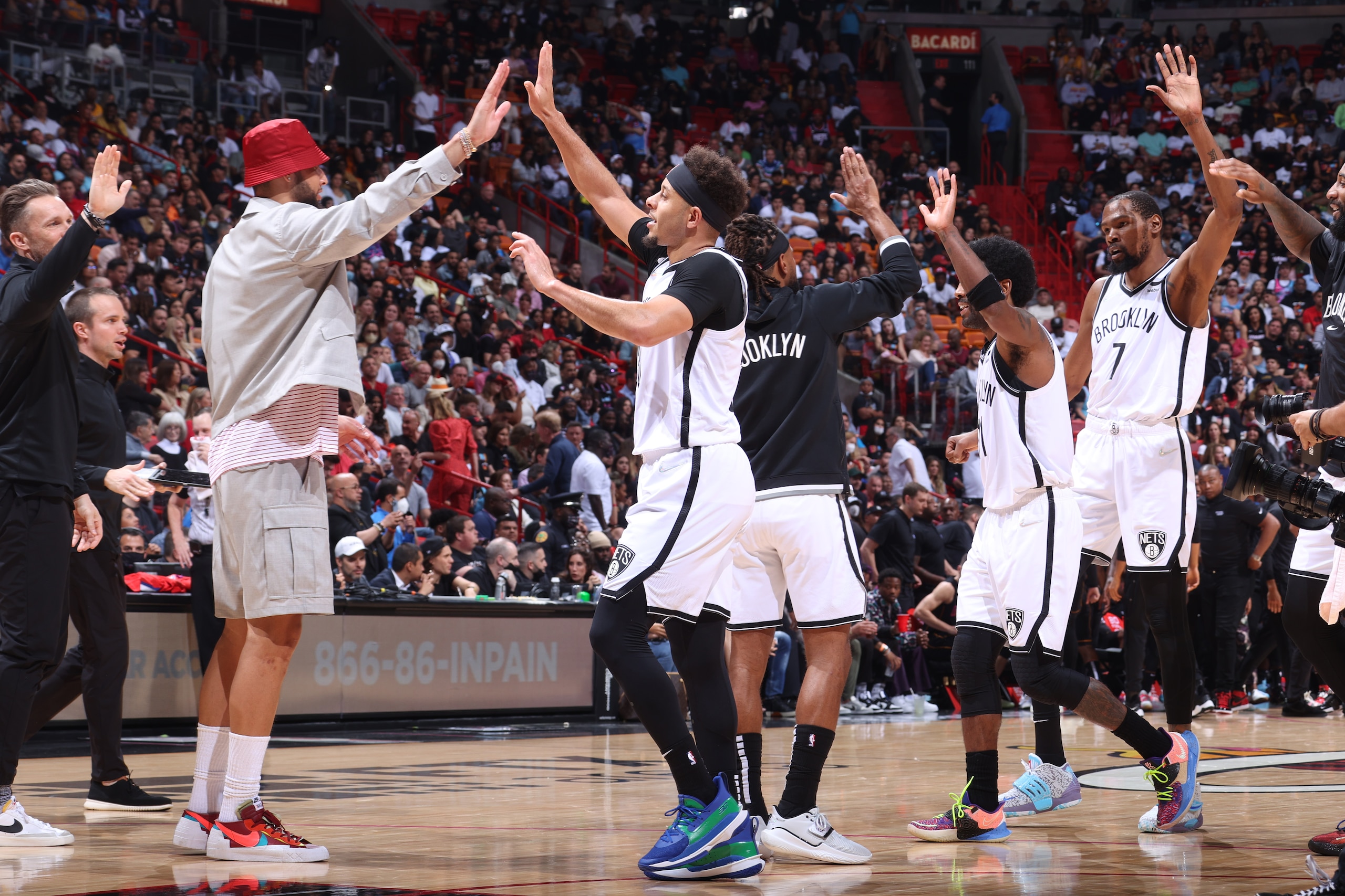MIAMI, FL - MARCH 26: The Brooklyn Nets high five during the game against the Miami Heat on March 26, 2022 at FTX Arena in Miami, Florida. NOTE TO USER: User expressly acknowledges and agrees that, by downloading and or using this Photograph, user is consenting to the terms and conditions of the Getty Images License Agreement. Mandatory Copyright Notice: Copyright 2022 NBAE (Photo by Nathaniel S. Butler/NBAE via Getty Images) MIAMI, FL - MARCH 26: The Brooklyn Nets high five during the game against the Miami Heat on March 26, 2022 at FTX Arena in Miami, Florida. NOTE TO USER: User expressly acknowledges and agrees that, by downloading and or using this Photograph, user is consenting to the terms and conditions of the Getty Images License Agreement. Mandatory Copyright Notice: Copyright 2022 NBAE (Photo by Nathaniel S. Butler/NBAE via Getty Images)