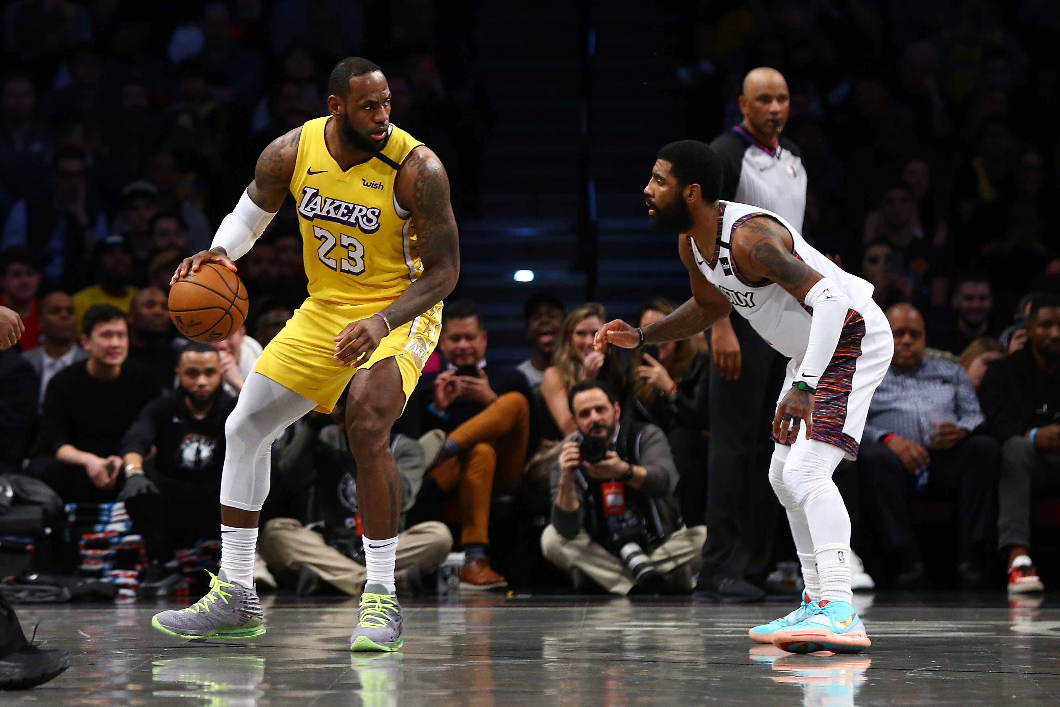 NEW YORK, NEW YORK - JANUARY 23:  LeBron James #23 of the Los Angeles Lakers drives to the basket against Kyrie Irving #11 of the Brooklyn Nets at Barclays Center on January 23, 2020 in New York City. NOTE TO USER: User expressly acknowledges and agrees that, by downloading and or using this photograph, User is consenting to the terms and conditions of the Getty Images License Agreement.   (Photo by Mike Stobe/Getty Images)