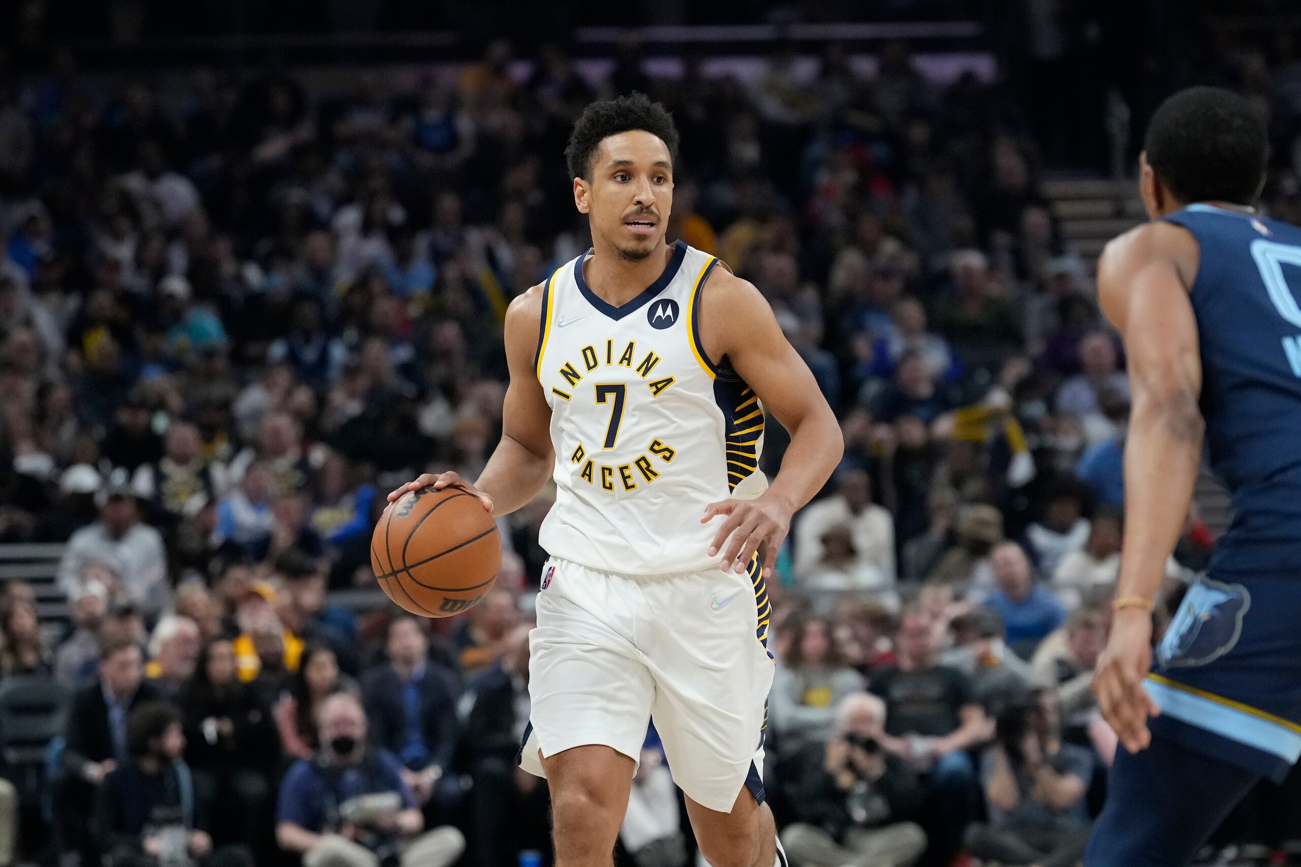 INDIANAPOLIS, IN - MARCH 15: Malcolm Brogdon #7 of the Indiana Pacers dribbles the ball during the game against the Memphis Grizzlies on March 15, 2022 at Gainbridge Fieldhouse in Indianapolis, Indiana. NOTE TO USER: User expressly acknowledges and agrees that, by downloading and or using this Photograph, user is consenting to the terms and conditions of the Getty Images License Agreement. Mandatory Copyright Notice: Copyright 2022 NBAE (Photo by A.J. Mast/NBAE via Getty Images) INDIANAPOLIS, IN - MARCH 15: Malcolm Brogdon #7 of the Indiana Pacers dribbles the ball during the game against the Memphis Grizzlies on March 15, 2022 at Gainbridge Fieldhouse in Indianapolis, Indiana. NOTE TO USER: User expressly acknowledges and agrees that, by downloading and or using this Photograph, user is consenting to the terms and conditions of the Getty Images License Agreement. Mandatory Copyright Notice: Copyright 2022 NBAE (Photo by A.J. Mast/NBAE via Getty Images)
